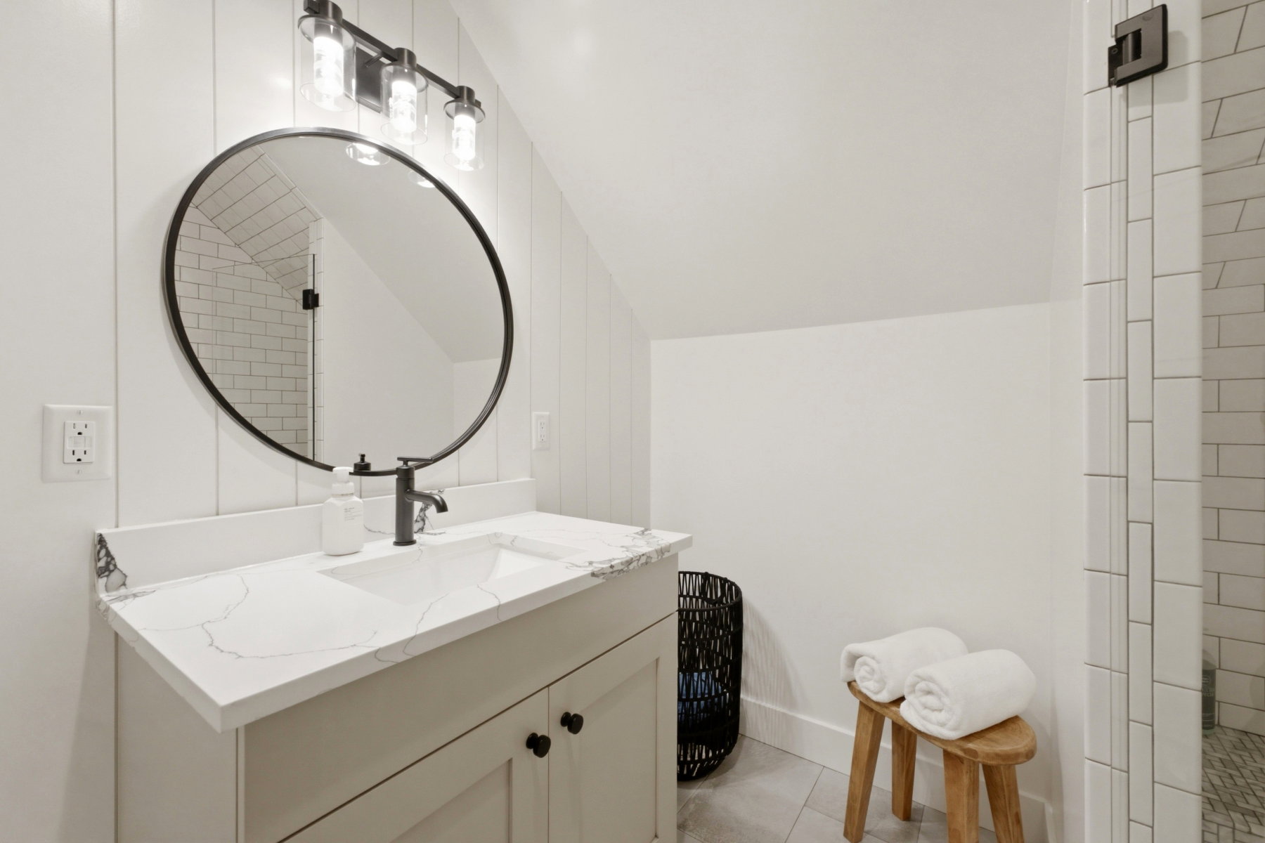 Modern bathroom featuring a contemporary vanity with a white countertop and integrated sink