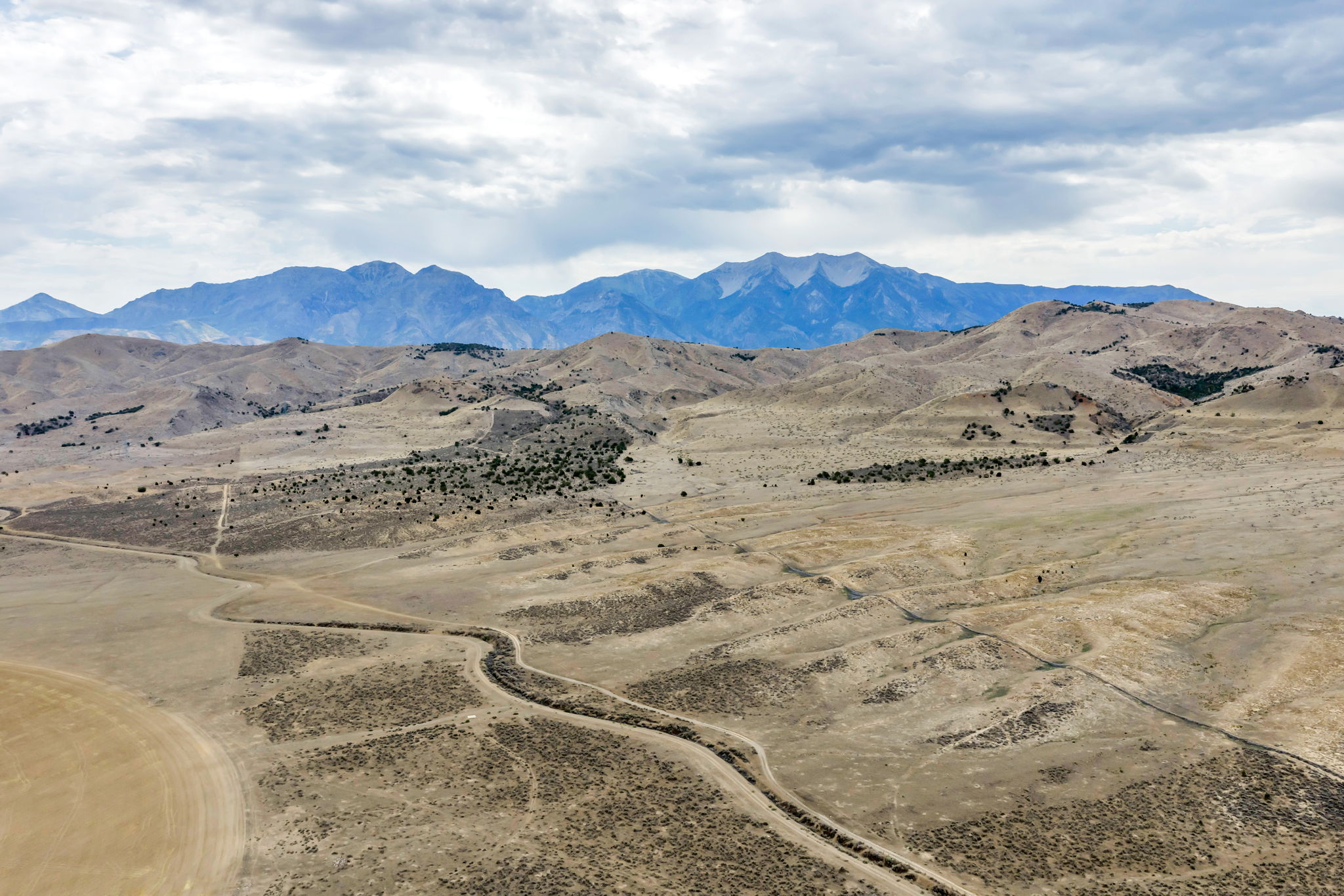 Expansive natural landscape with varied terrain and distant mountains