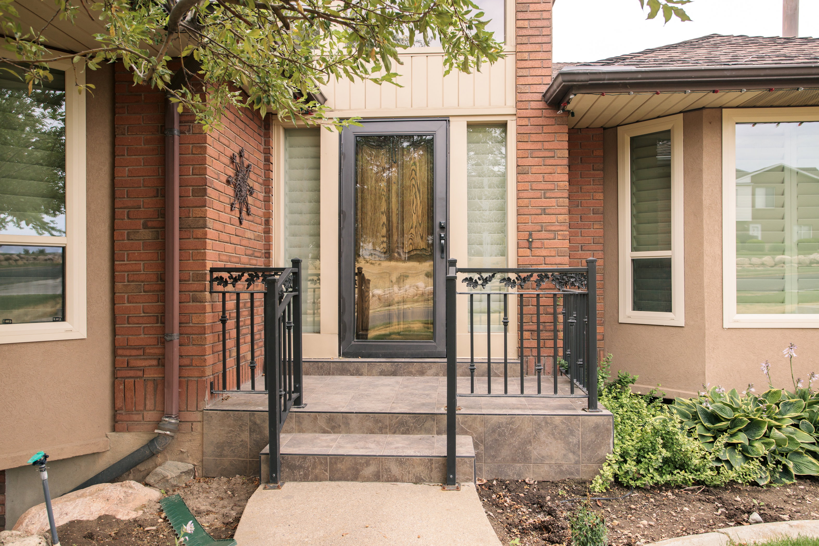 Front entry with brick and stucco exterior