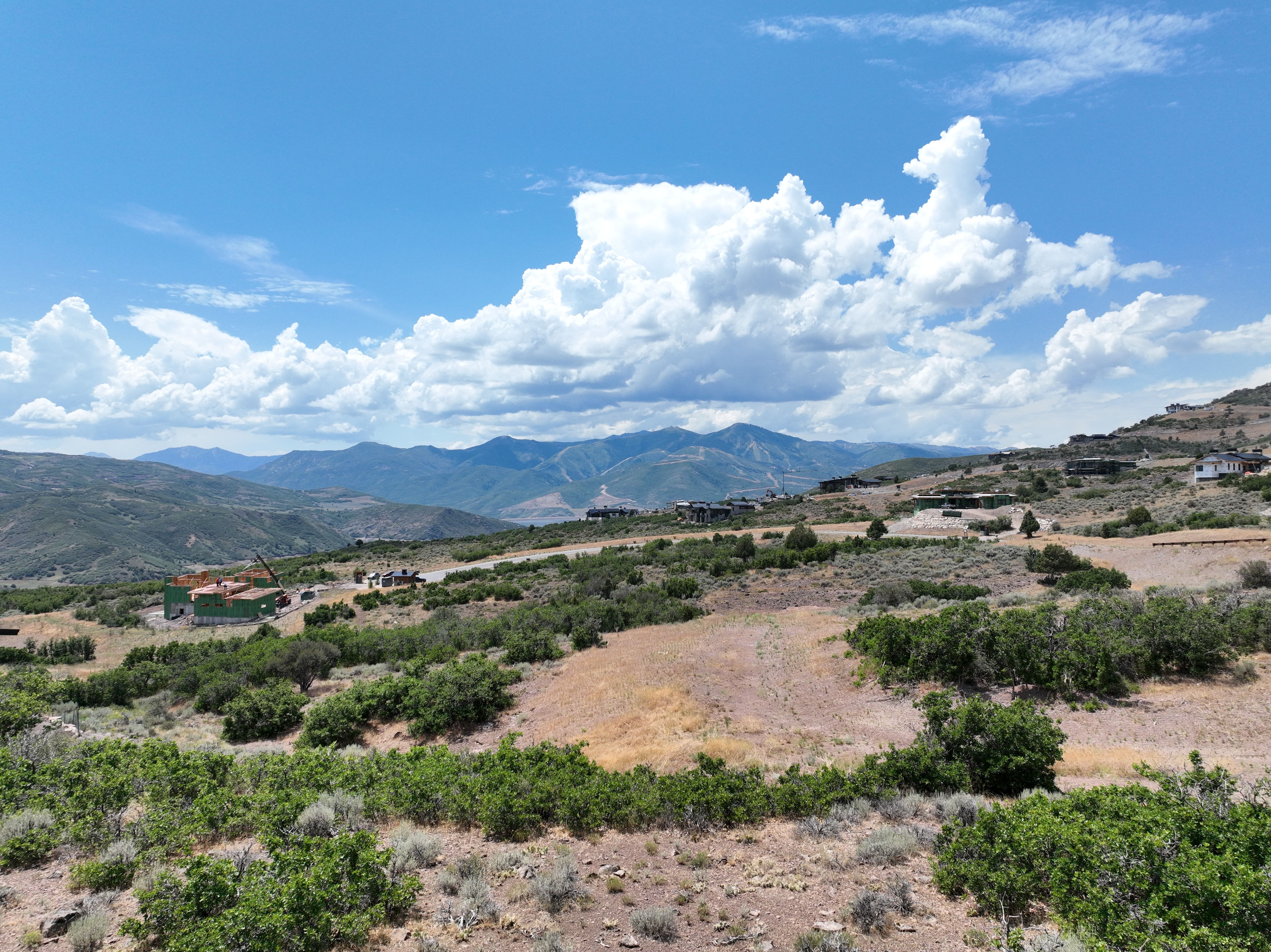 Expansive undeveloped land featuring natural shrubbery and mountainous terrain