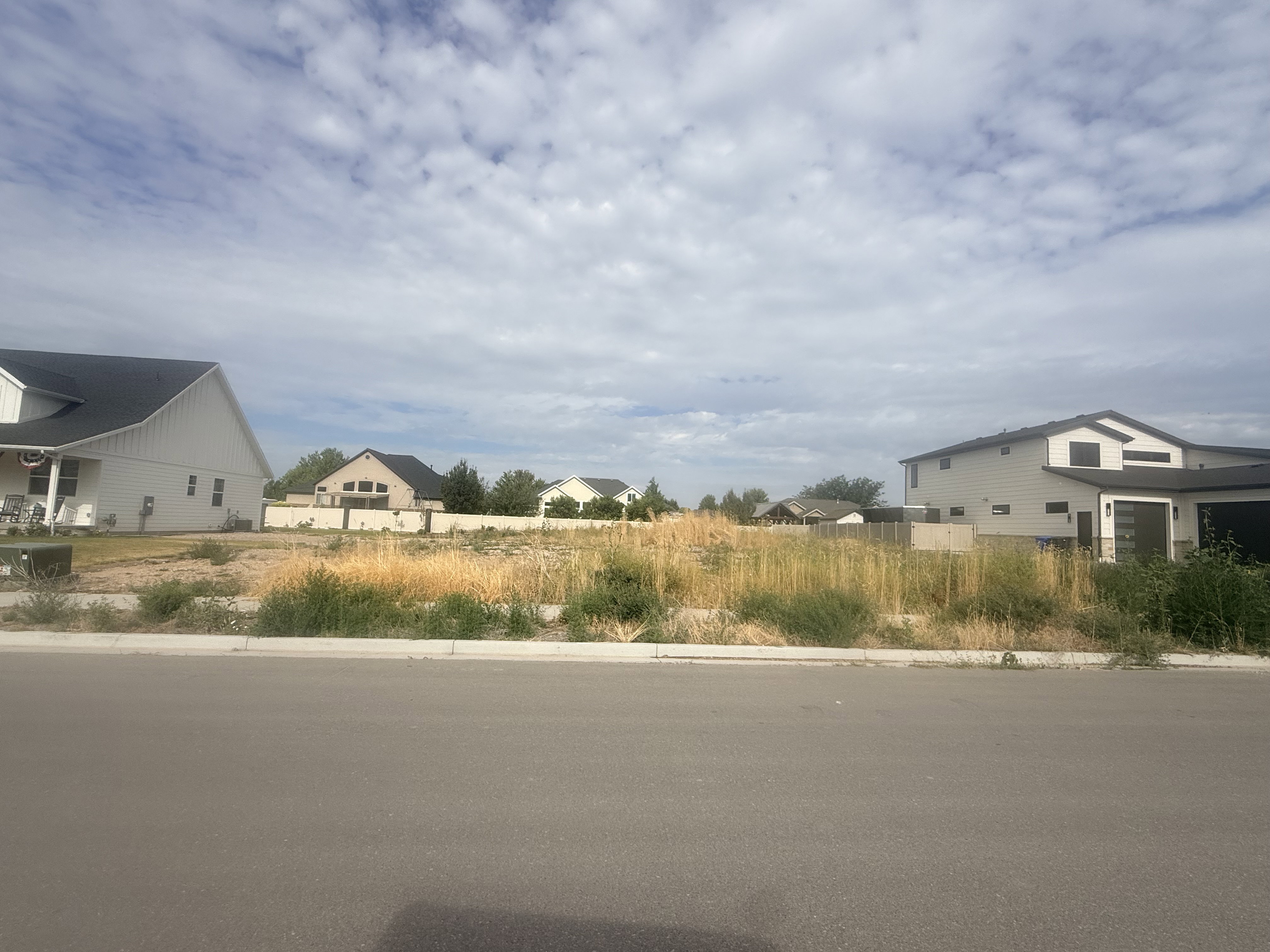 Vacant lot with established street frontage and curb