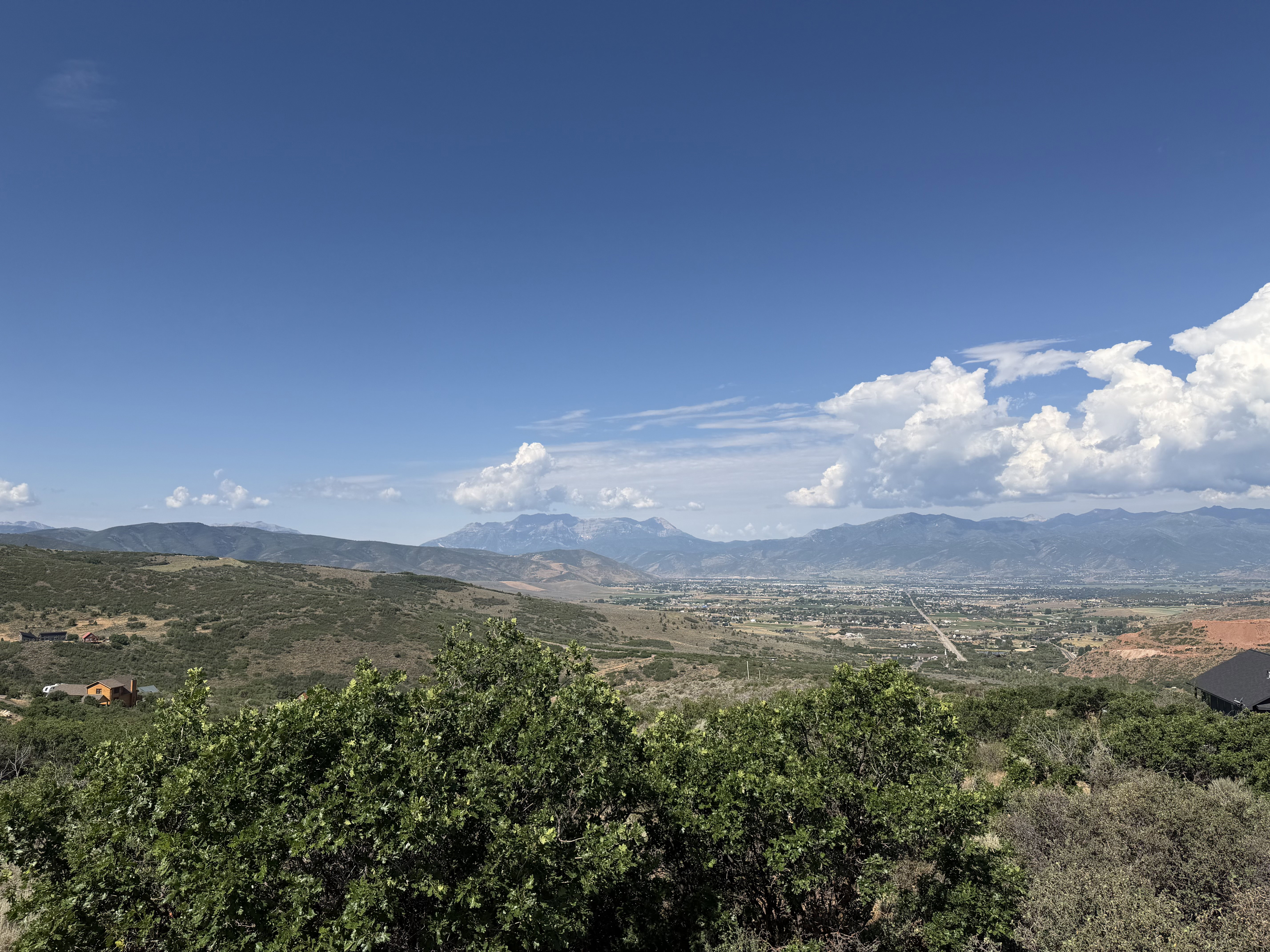 Expansive mountain and valley scenery under a clear sky