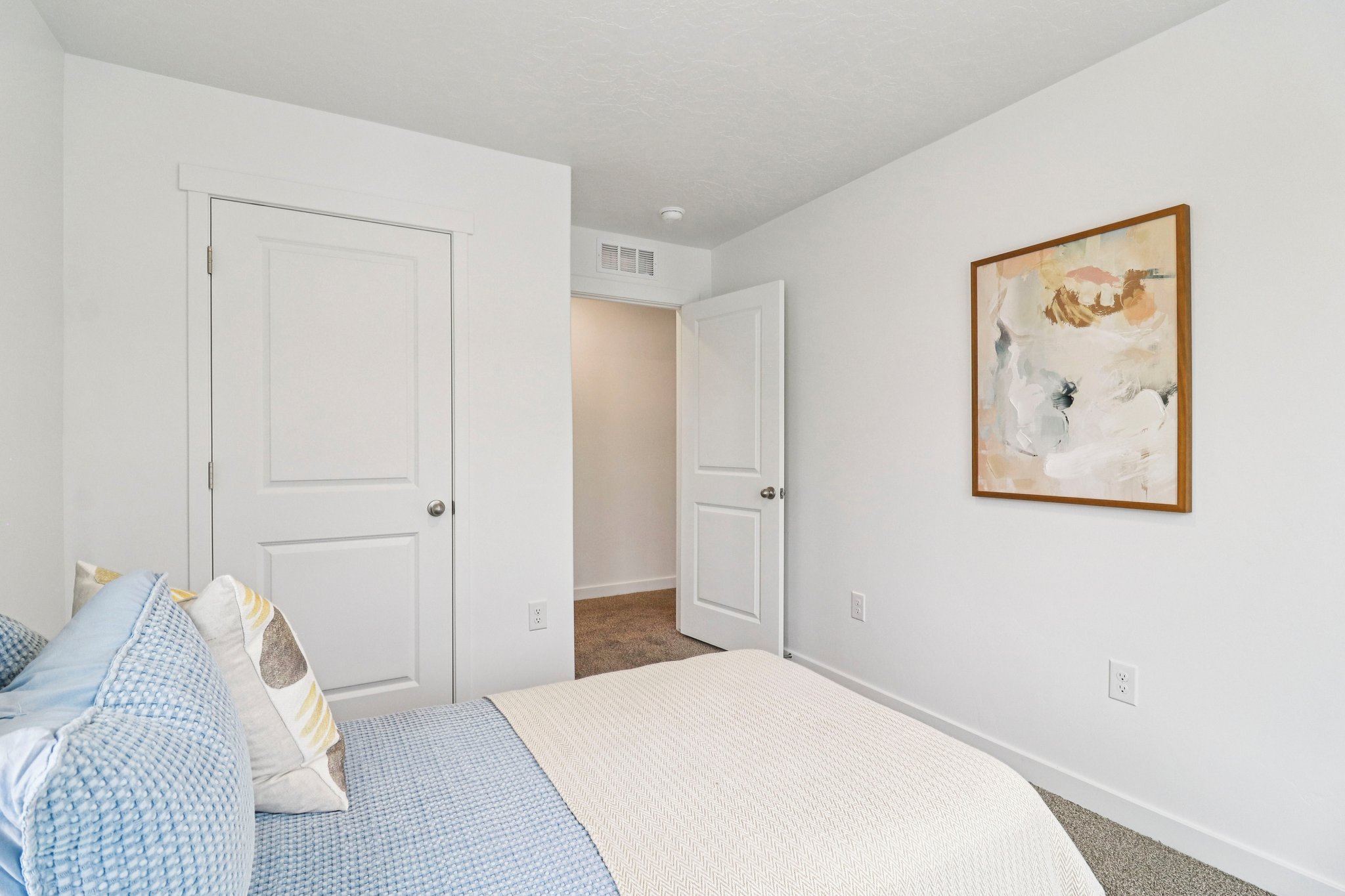 Room featuring white walls, white trim, and carpet flooring