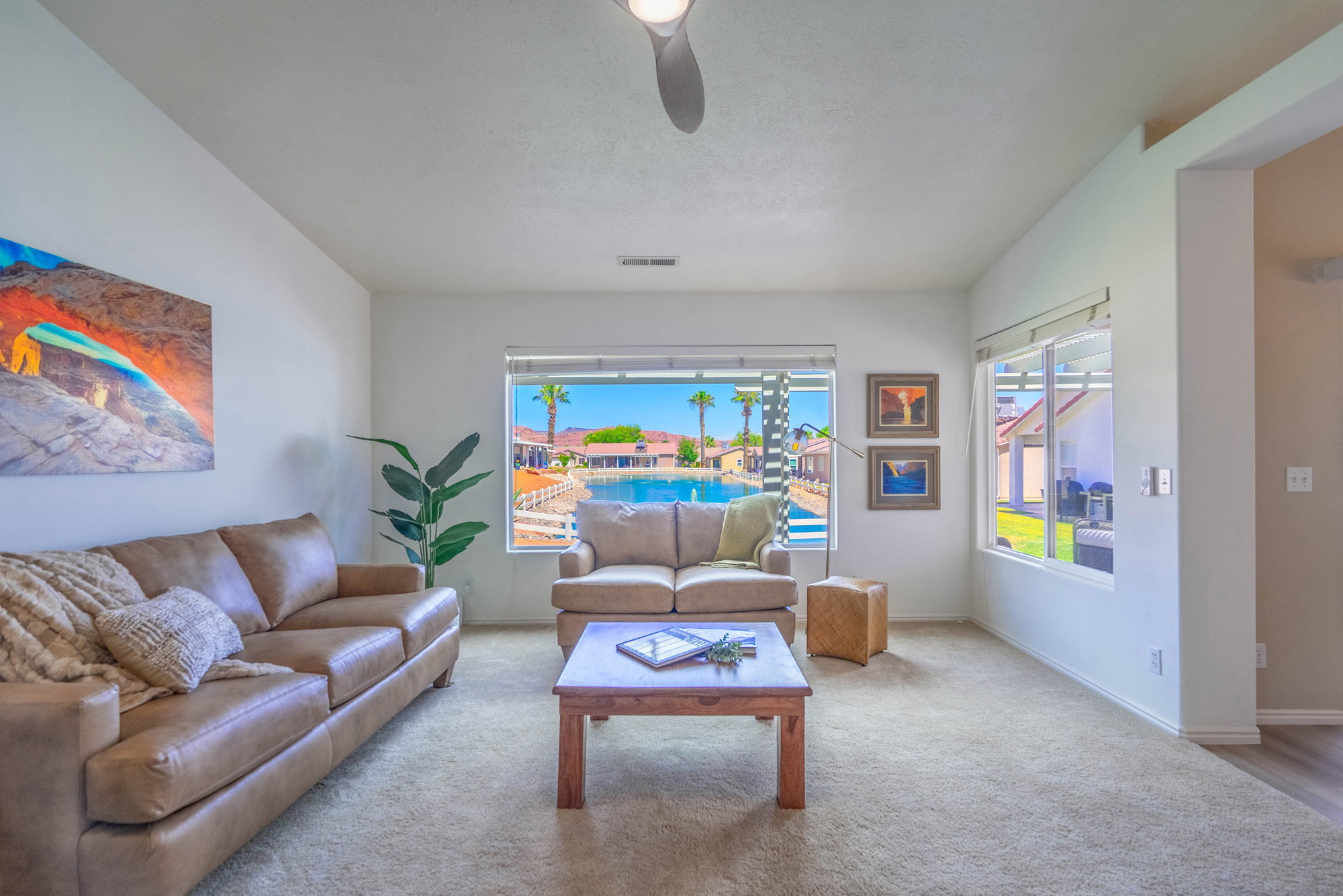 Interior living space featuring light-colored walls and carpeted flooring