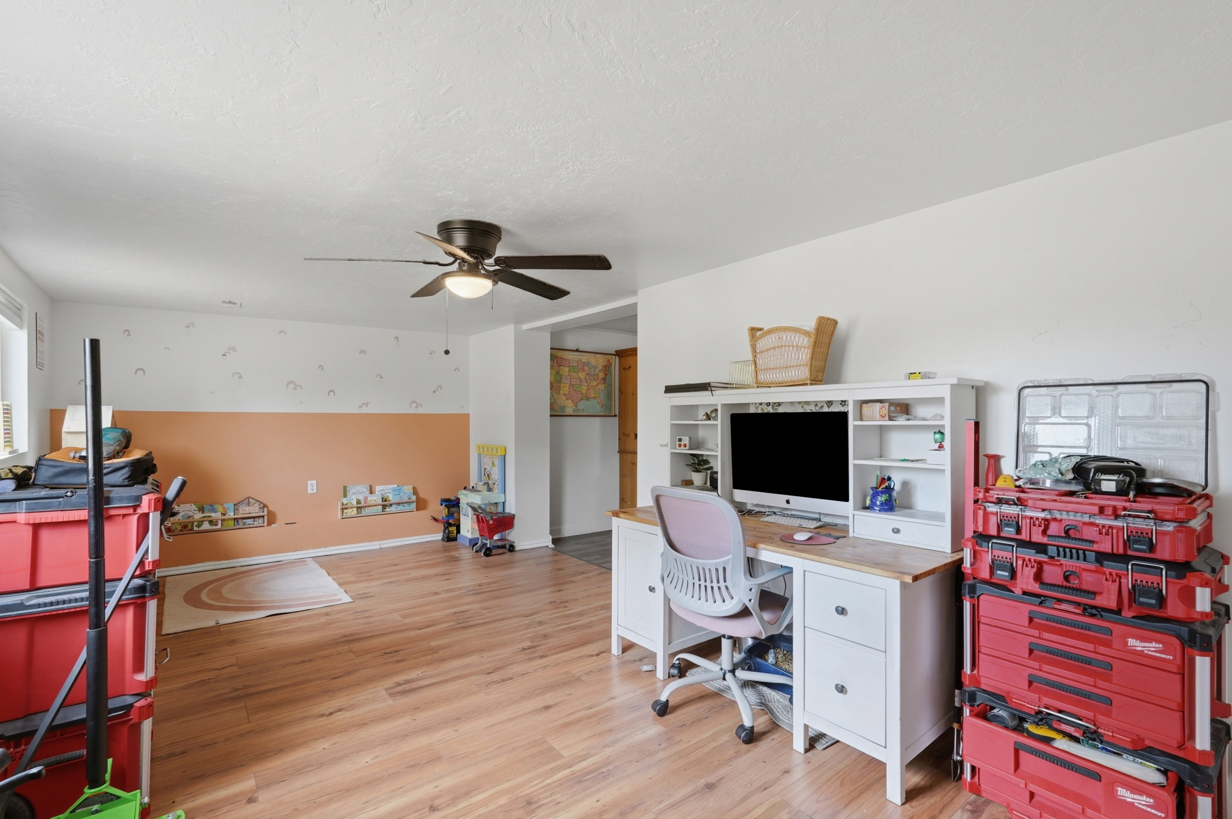 Spacious interior room with wood-finish flooring