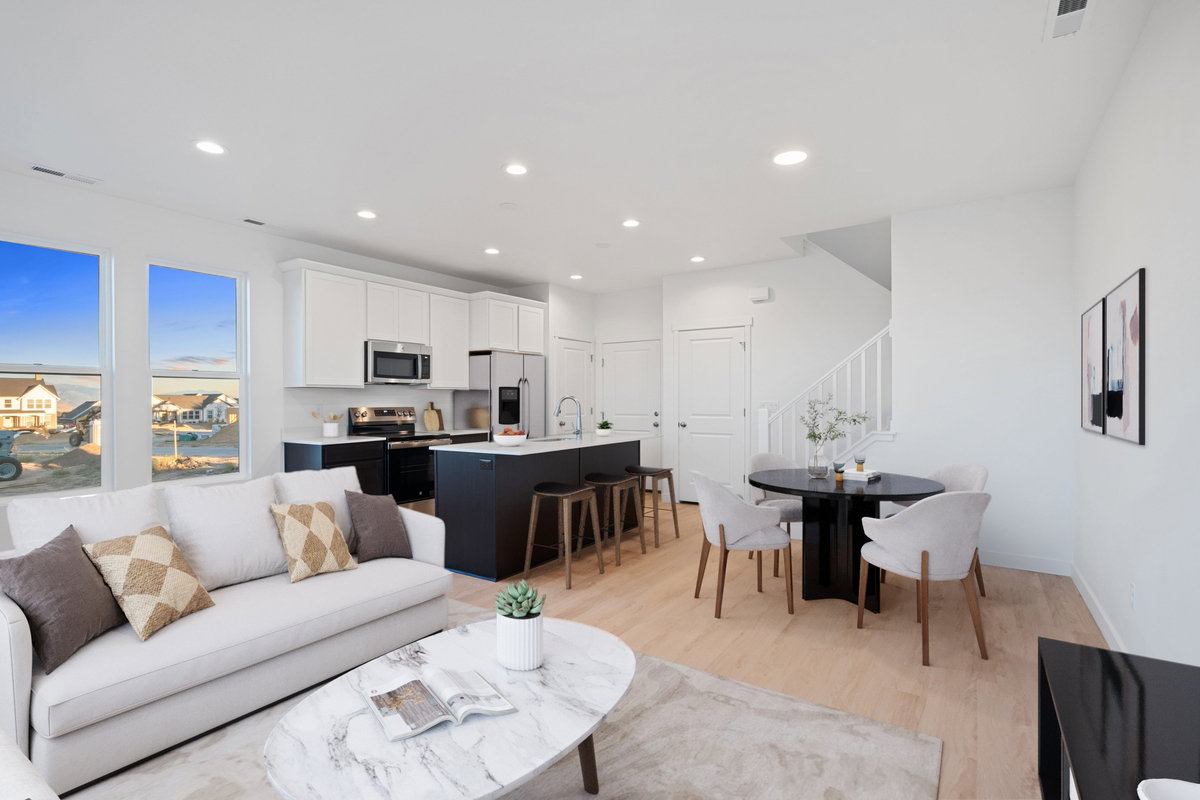 Open-concept living space featuring light wood-finish flooring