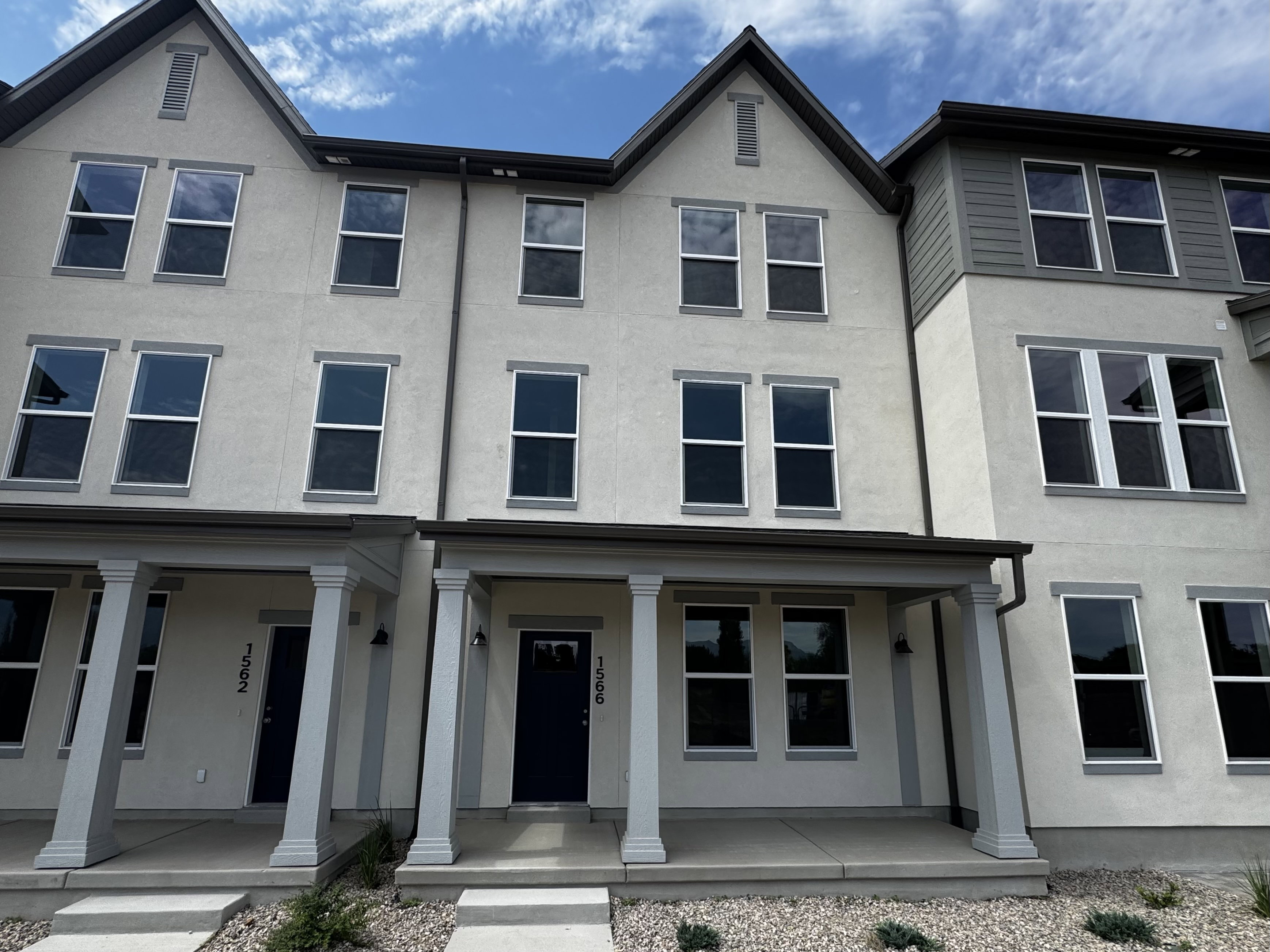 Contemporary stucco exterior with a multi-story design