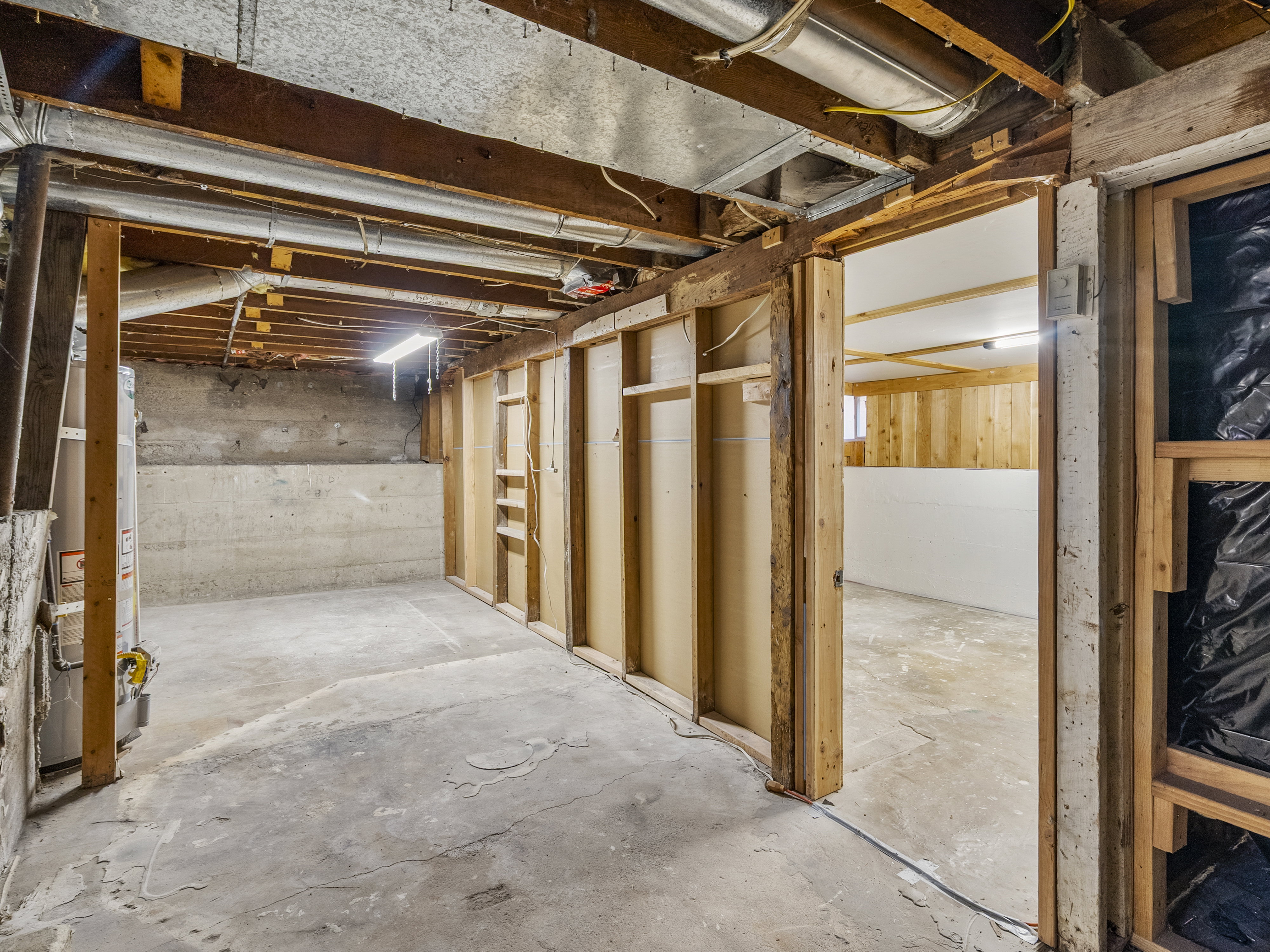 Entrance into unfinished basement bedroom.