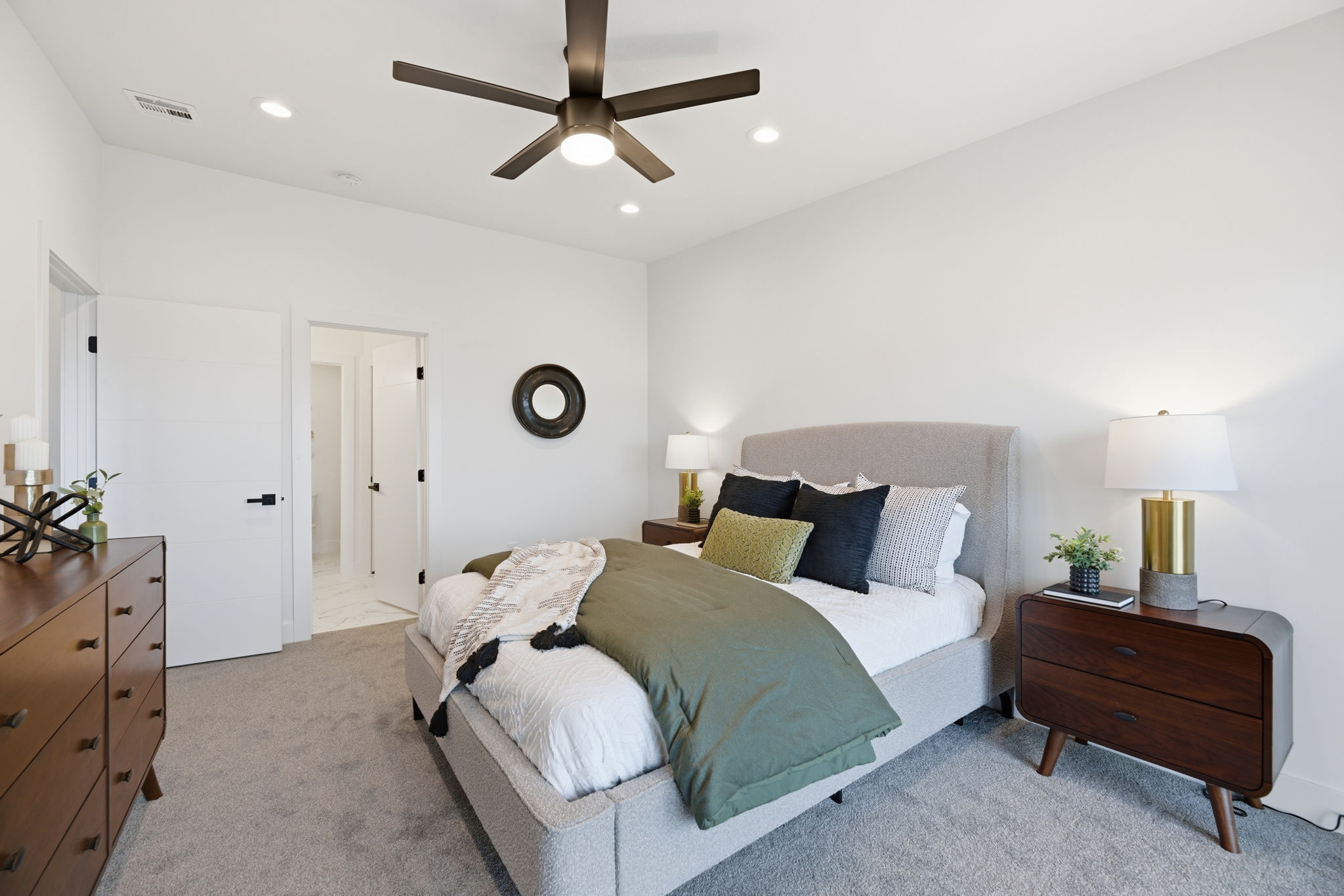 Carpeted bedroom featuring a ceiling fan with integrated lighting, recessed lighting, and white walls