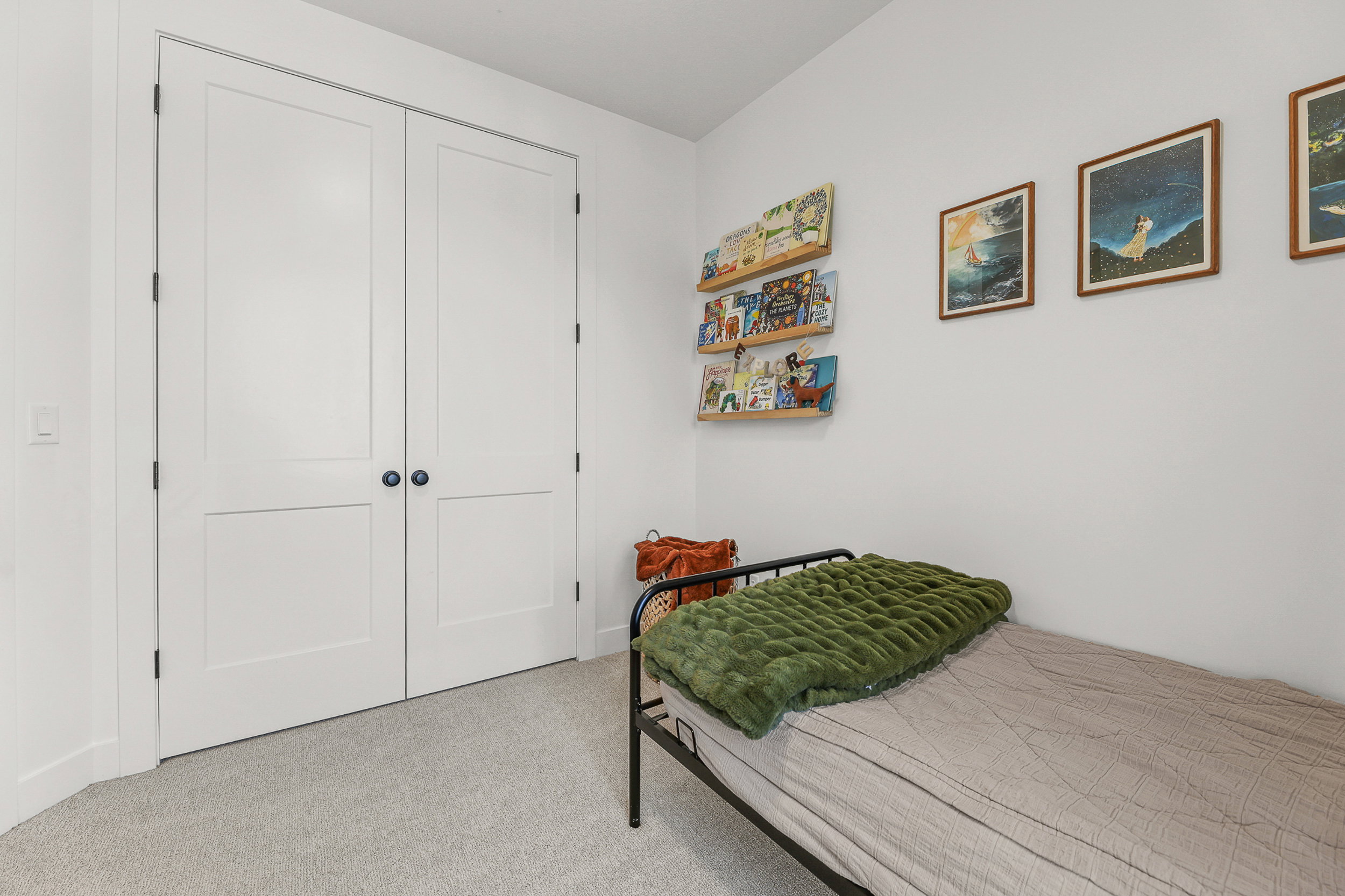 Room featuring light gray carpeting and white walls