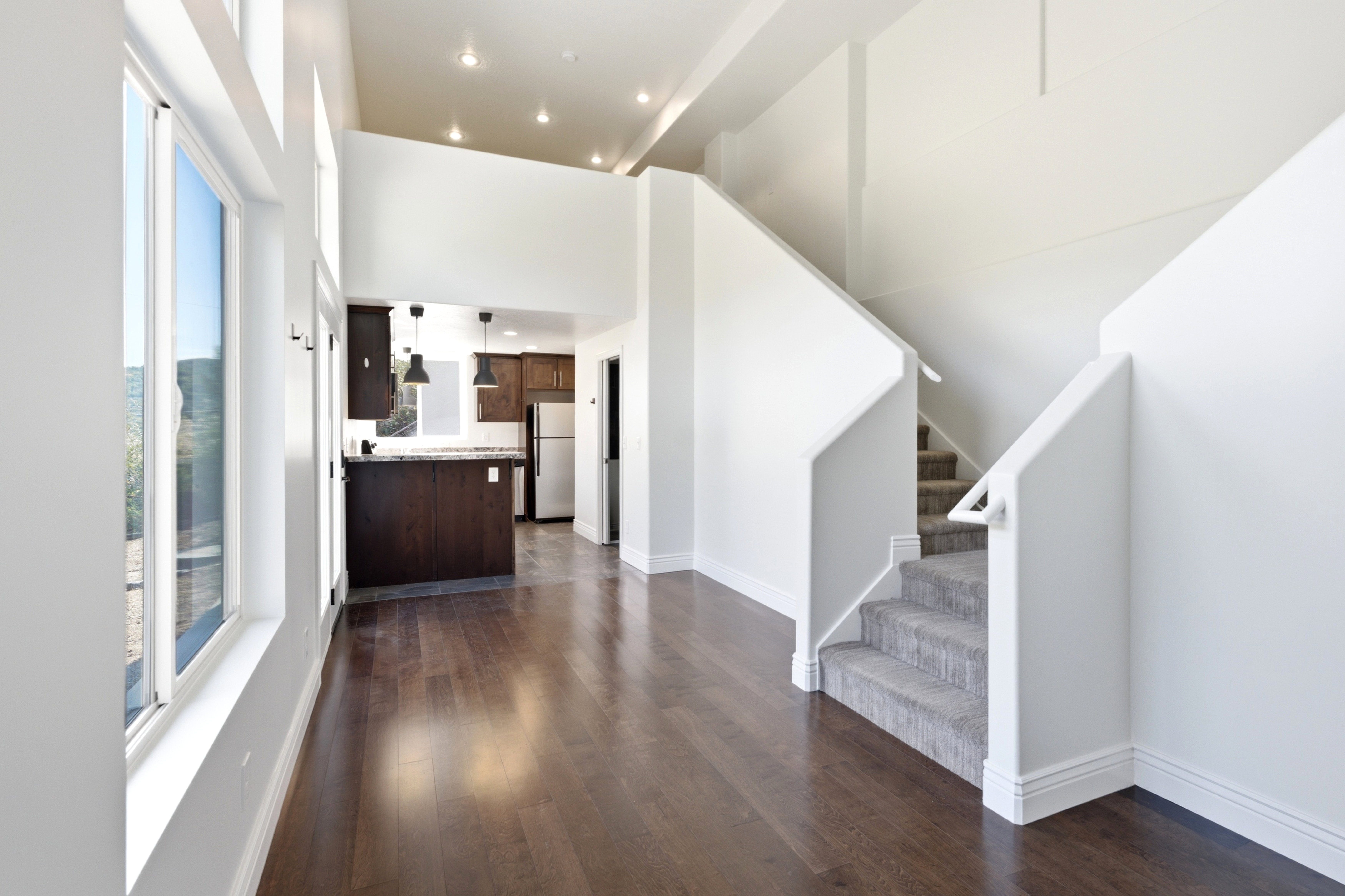 View of the steps to the den above the ADU kitchen
