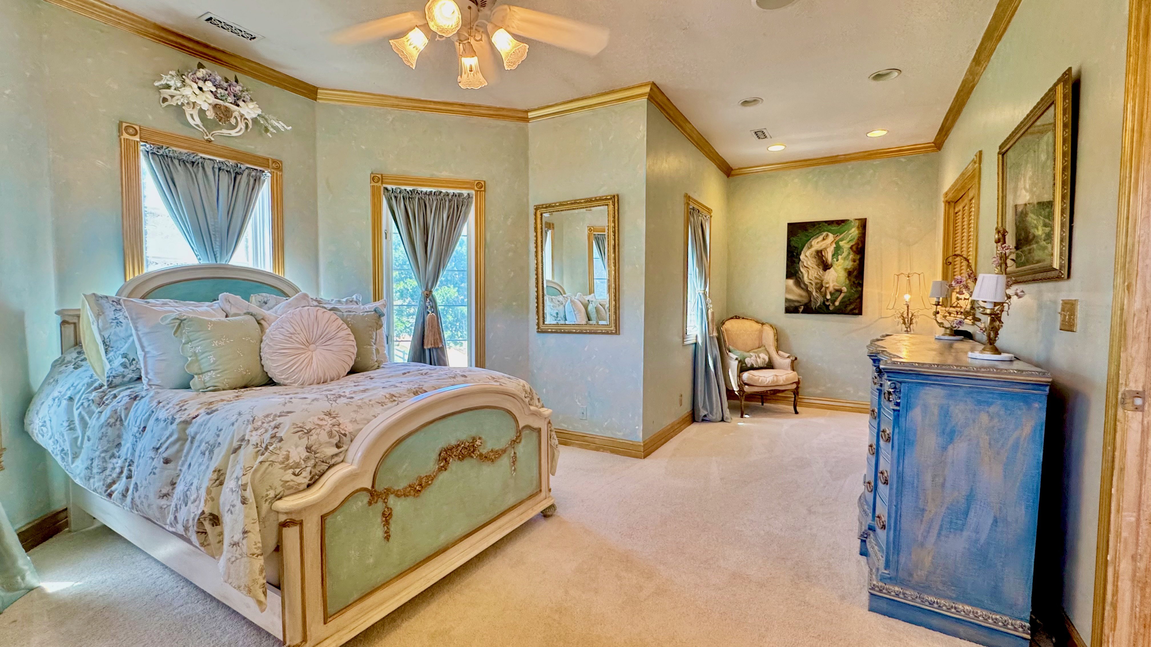 Textured walls with crown molding, recessed lighting, and a ceiling fan with light fixture