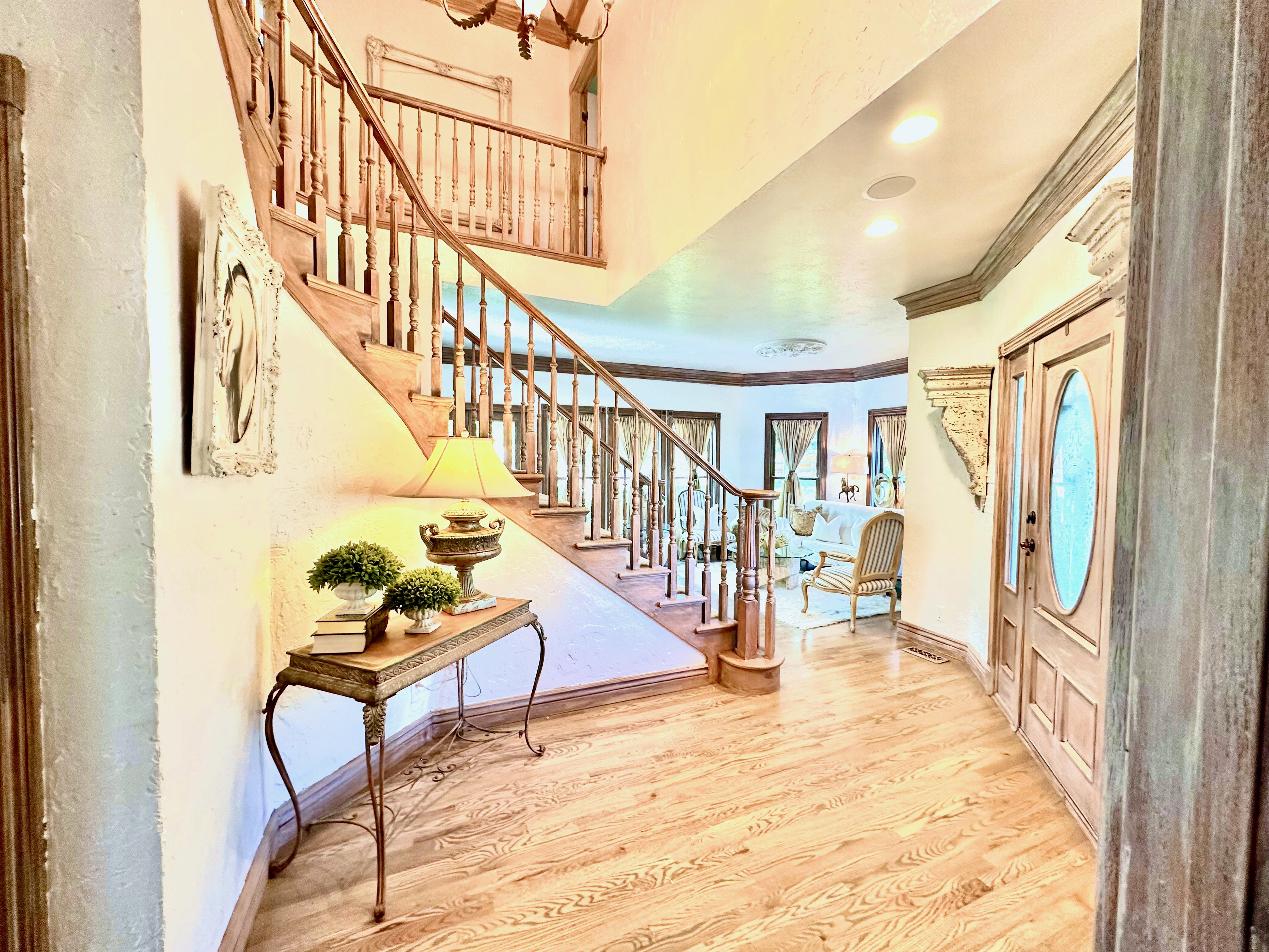 Grand staircase with wood-finish treads and balusters