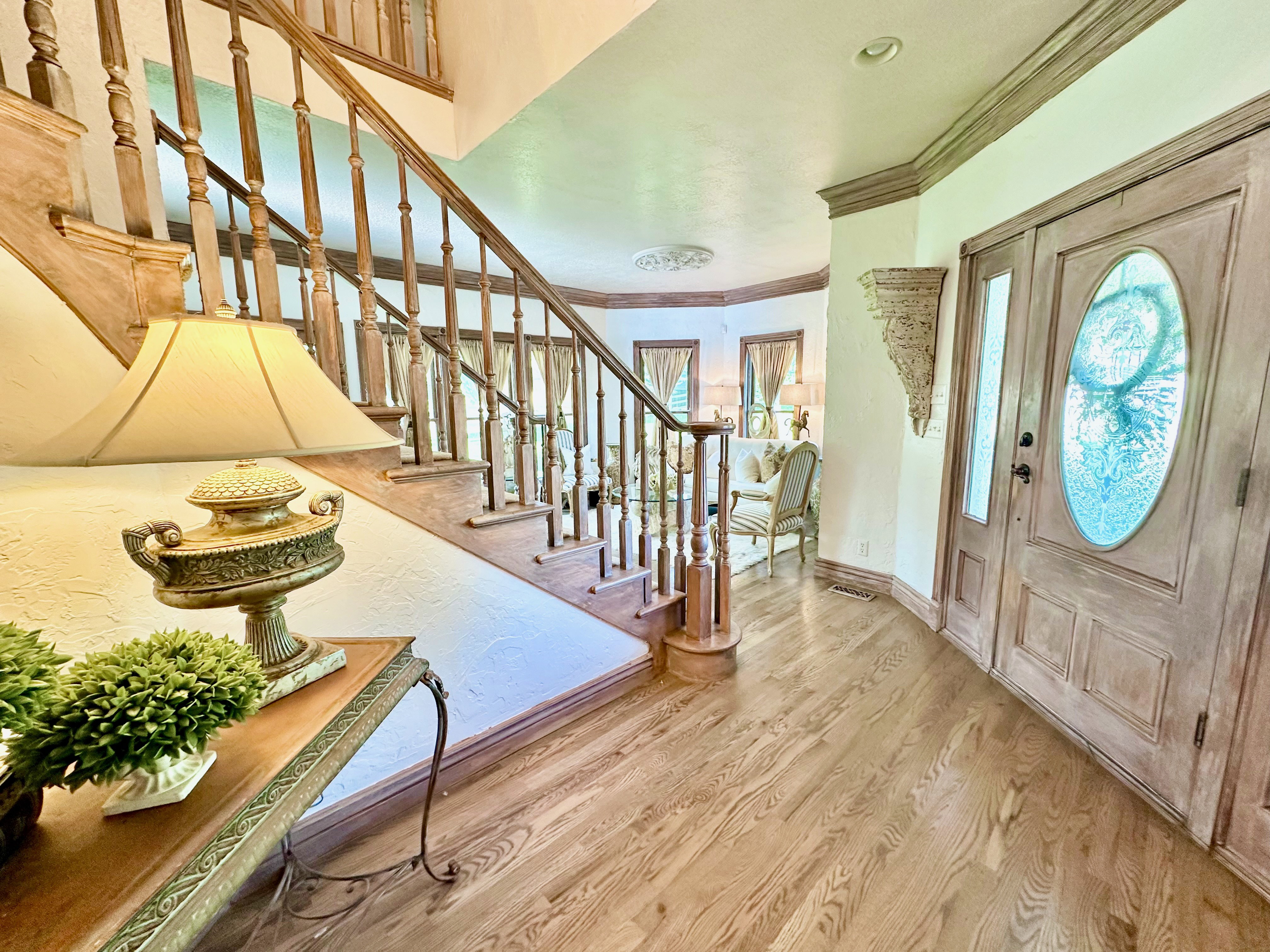 Light wood-finish flooring extending from the entryway