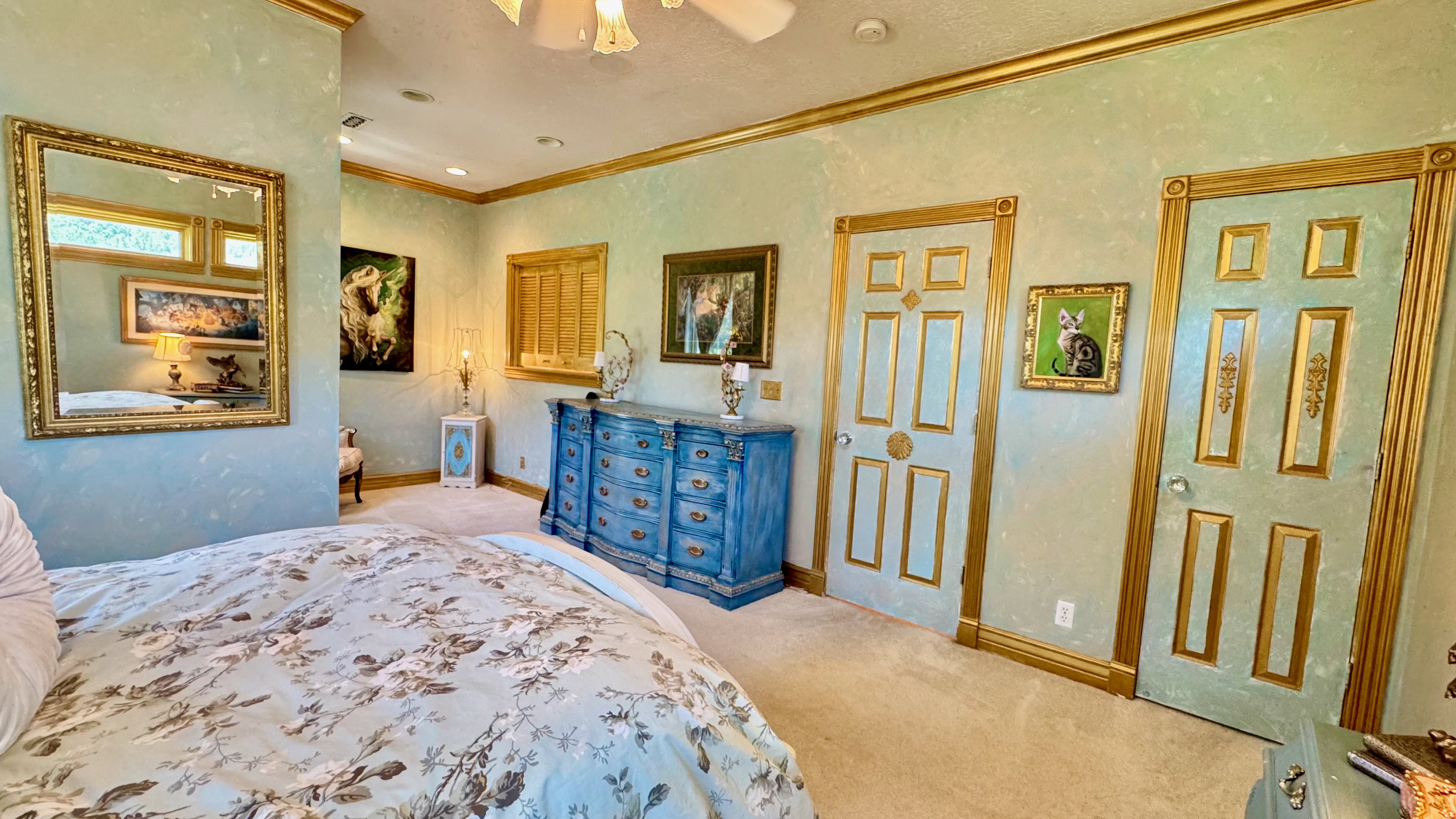 Textured walls with gold crown molding and trim