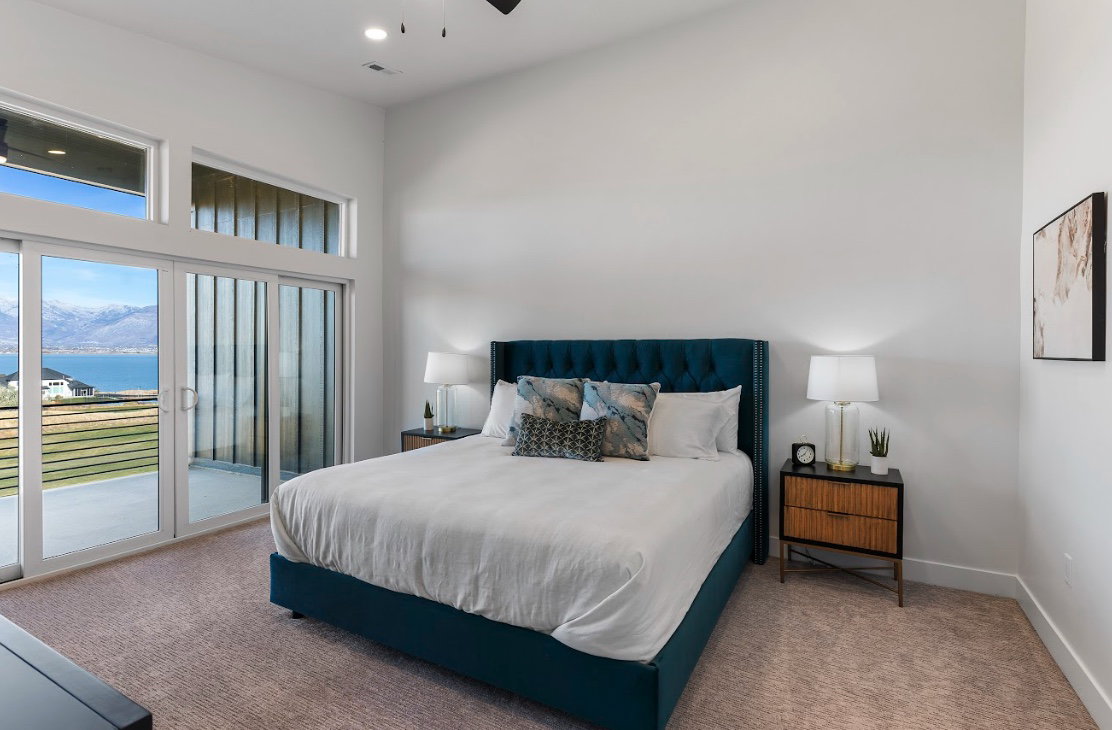 Carpeted room featuring a high ceiling, recessed lighting, and a ceiling fan