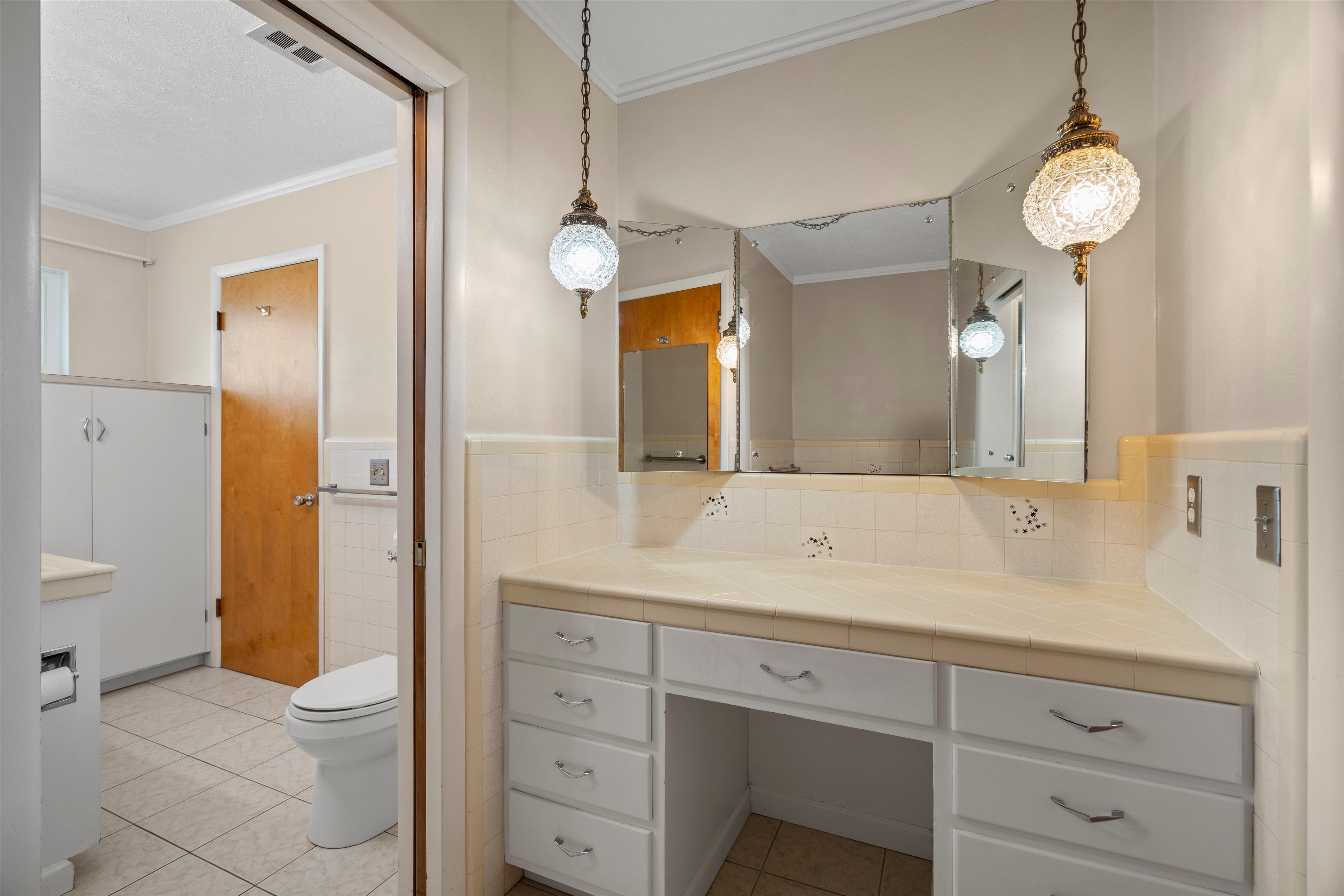 Vanity area in hall bathroom.