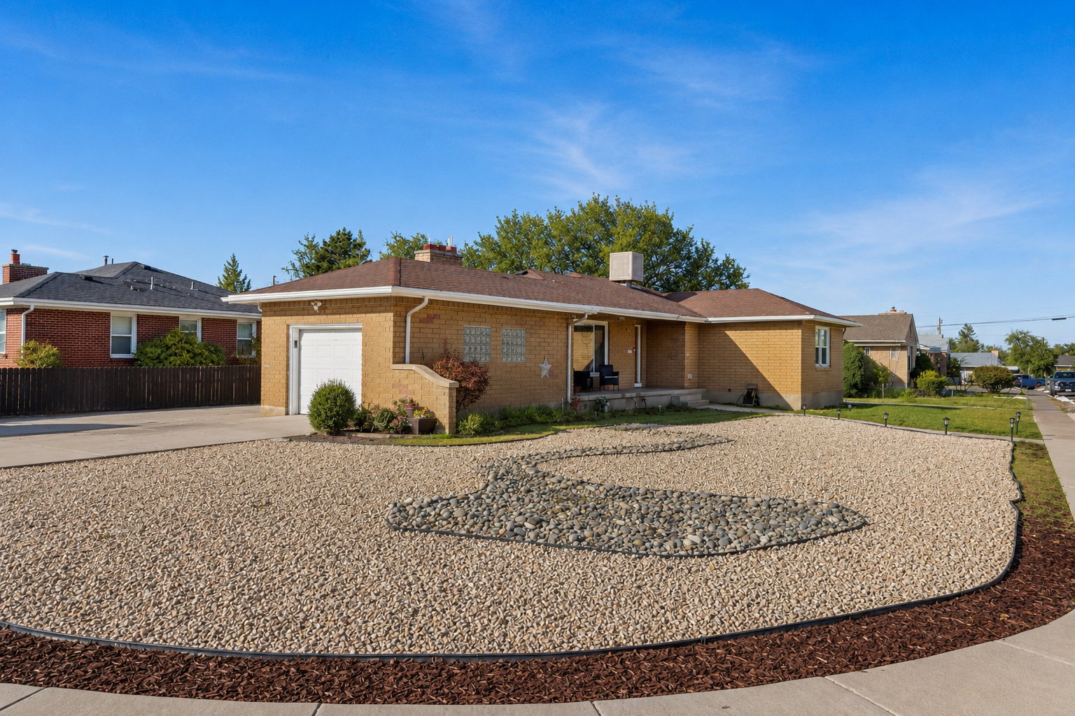 Brick exterior residence with an attached single-car garage