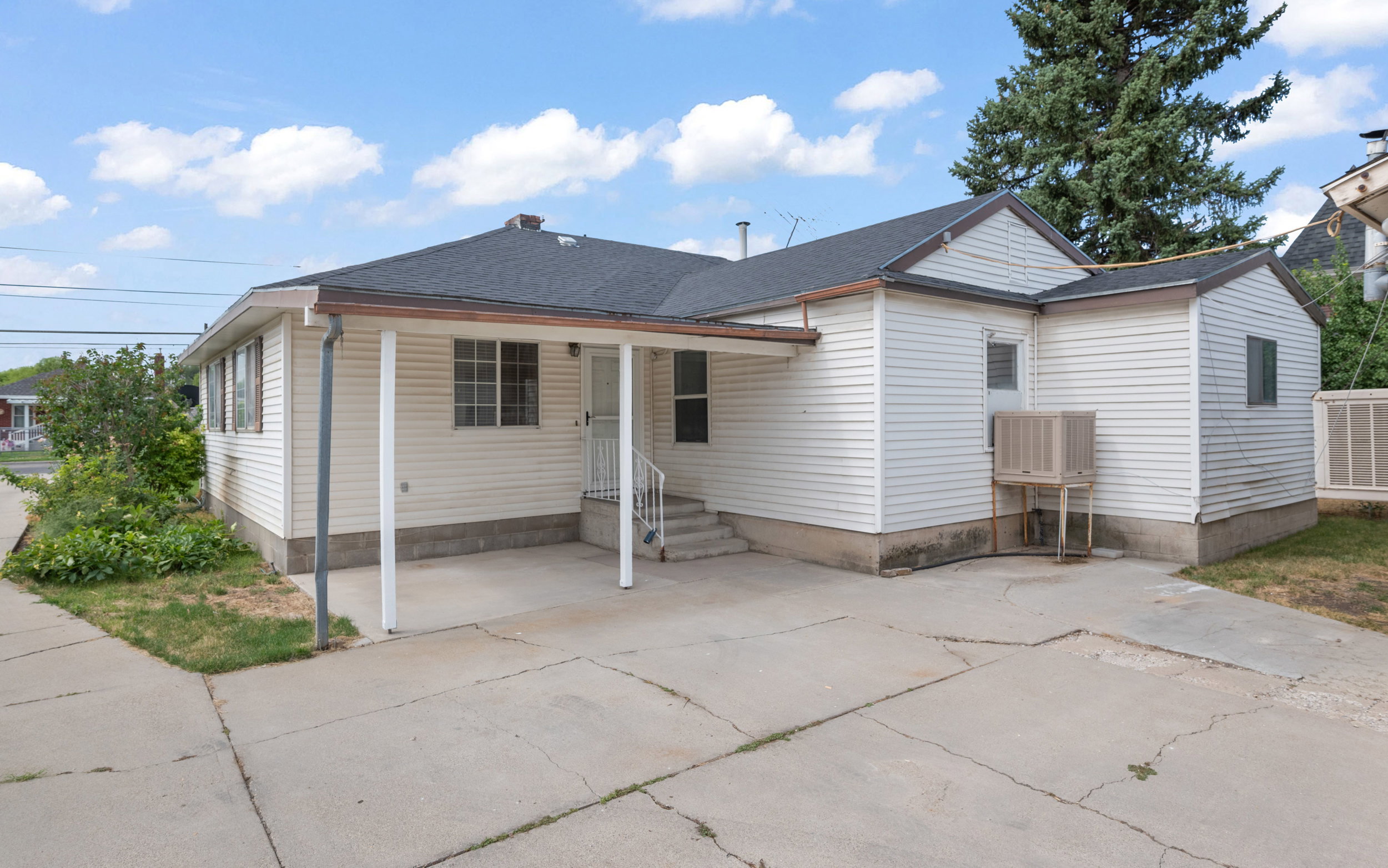 Back side of the residence with a covered patio.