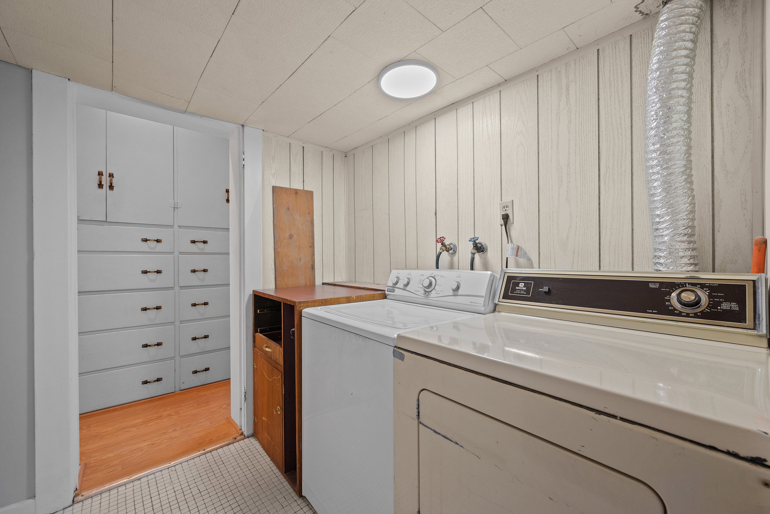 Laundry area located near both primary bedroom.