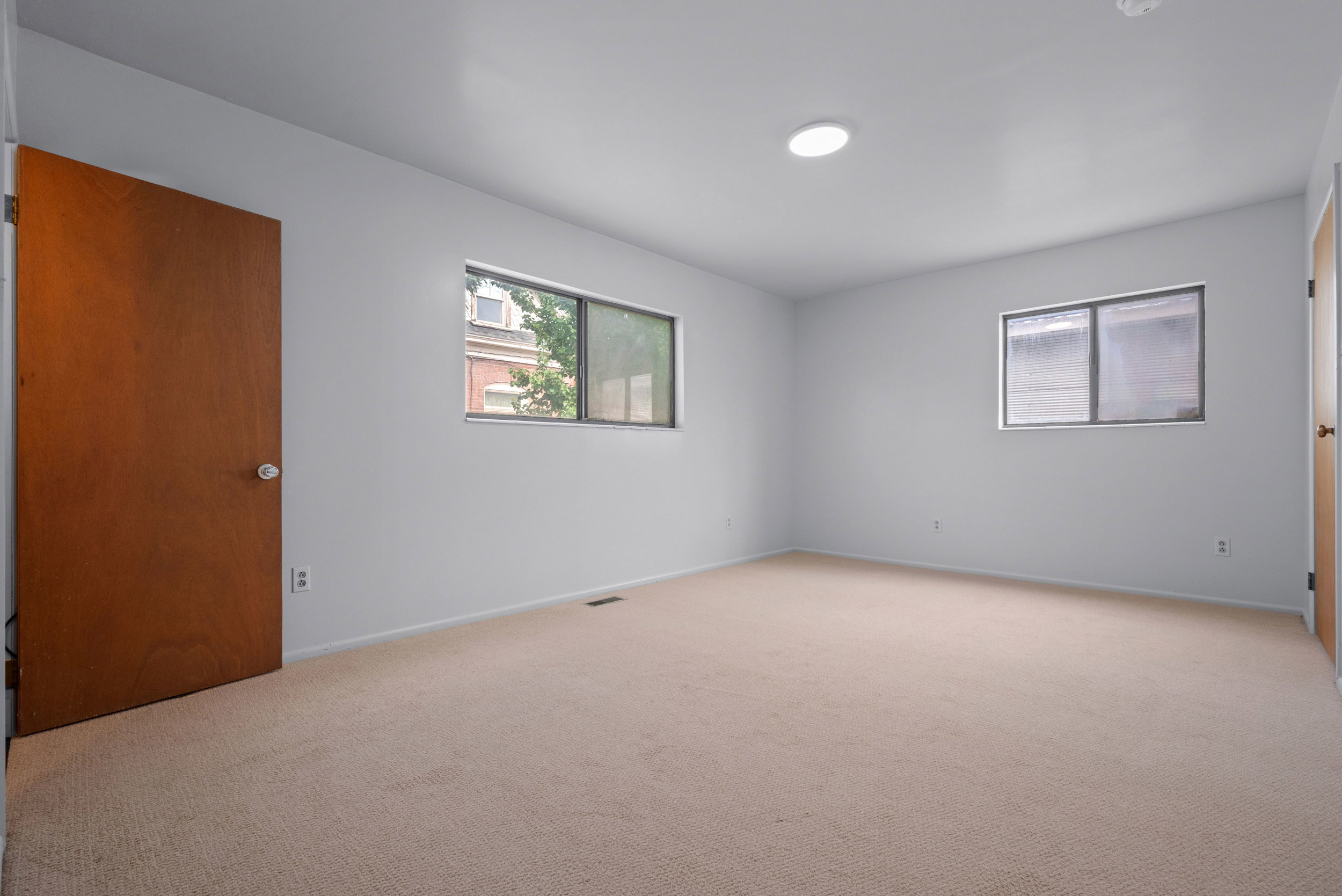 Primary Bedroom with en Suite, new paint and carpet.