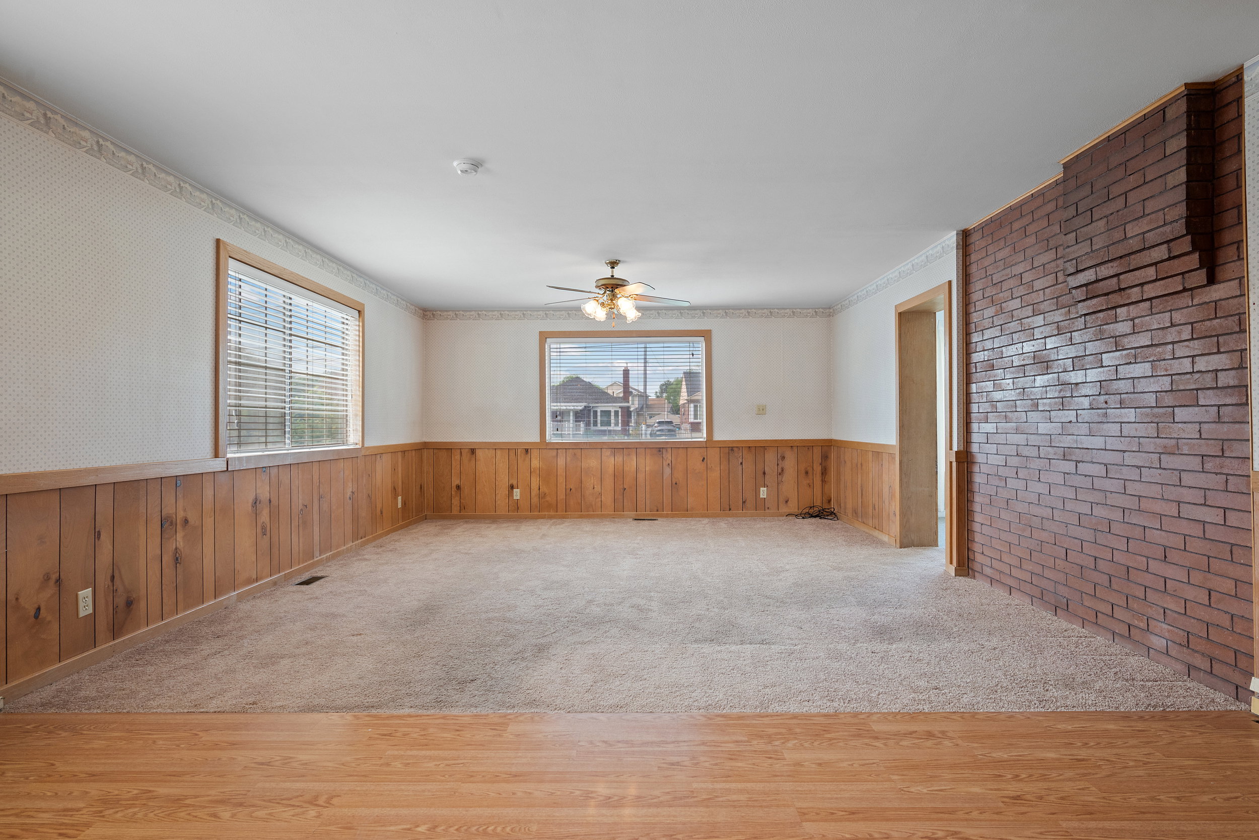 Large living room space with open living concept to dining and kitchen area.