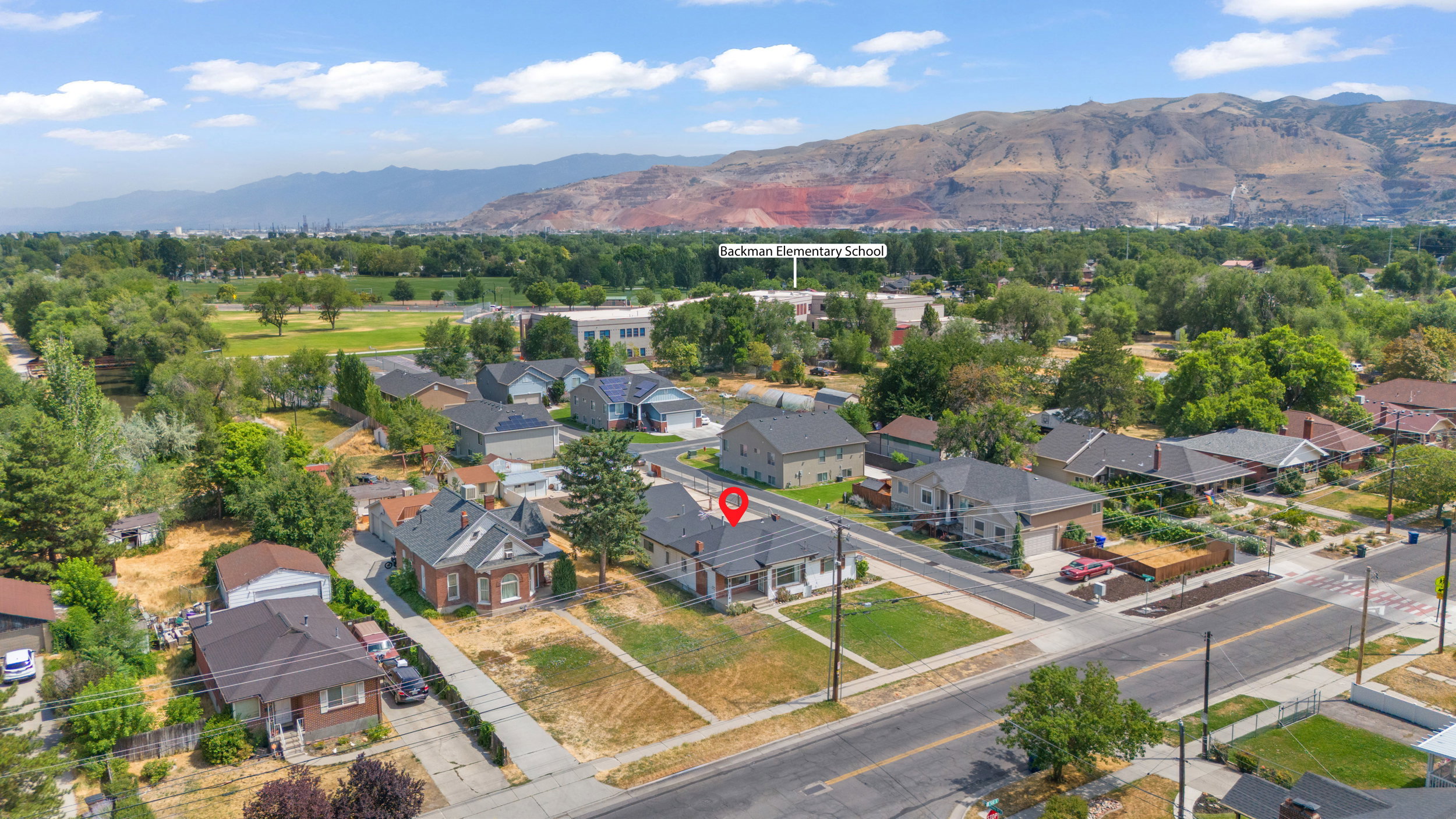 Aerial perspective showcasing a residential area with varied home styles and mature trees