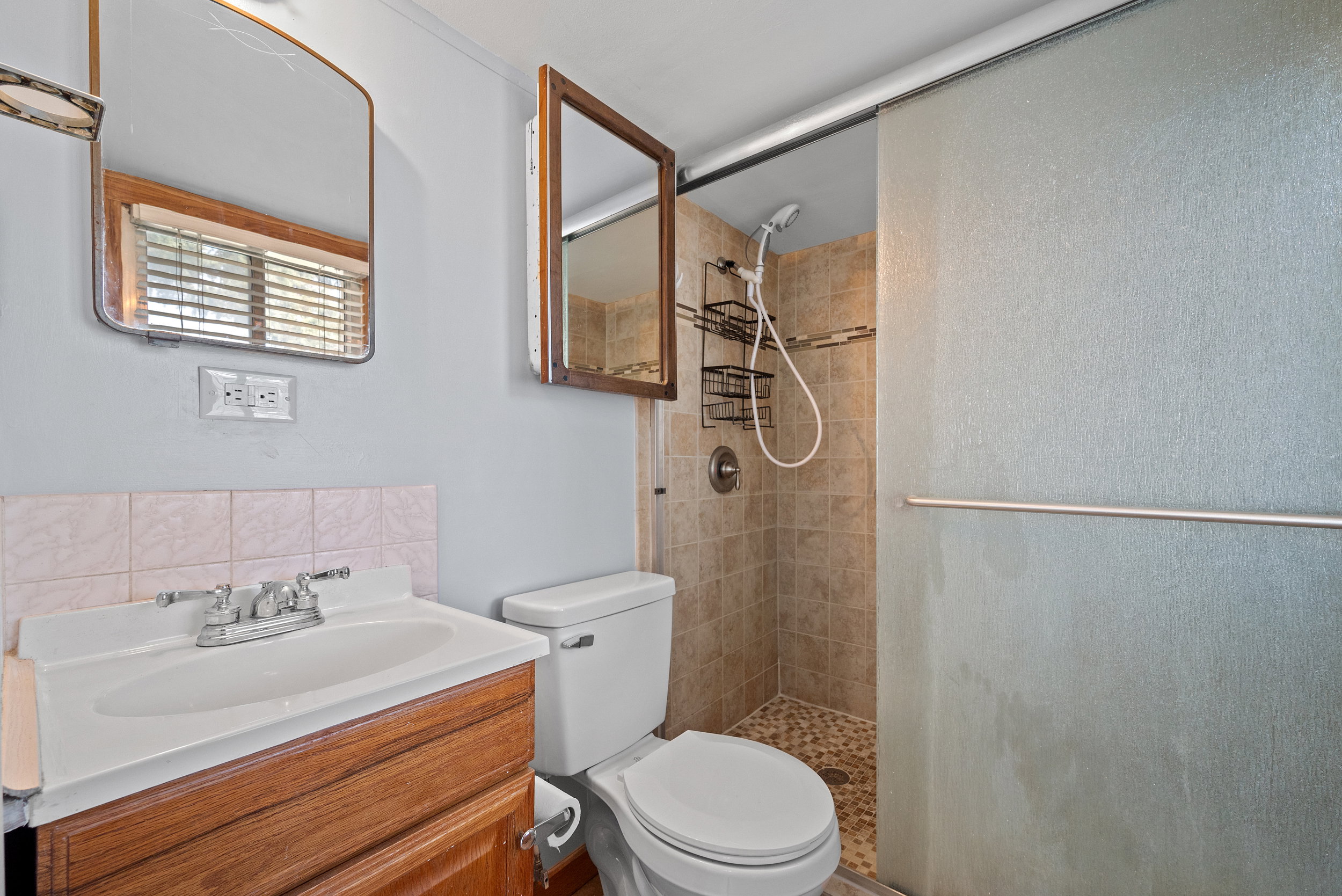 Primary en suite with walk in shower.