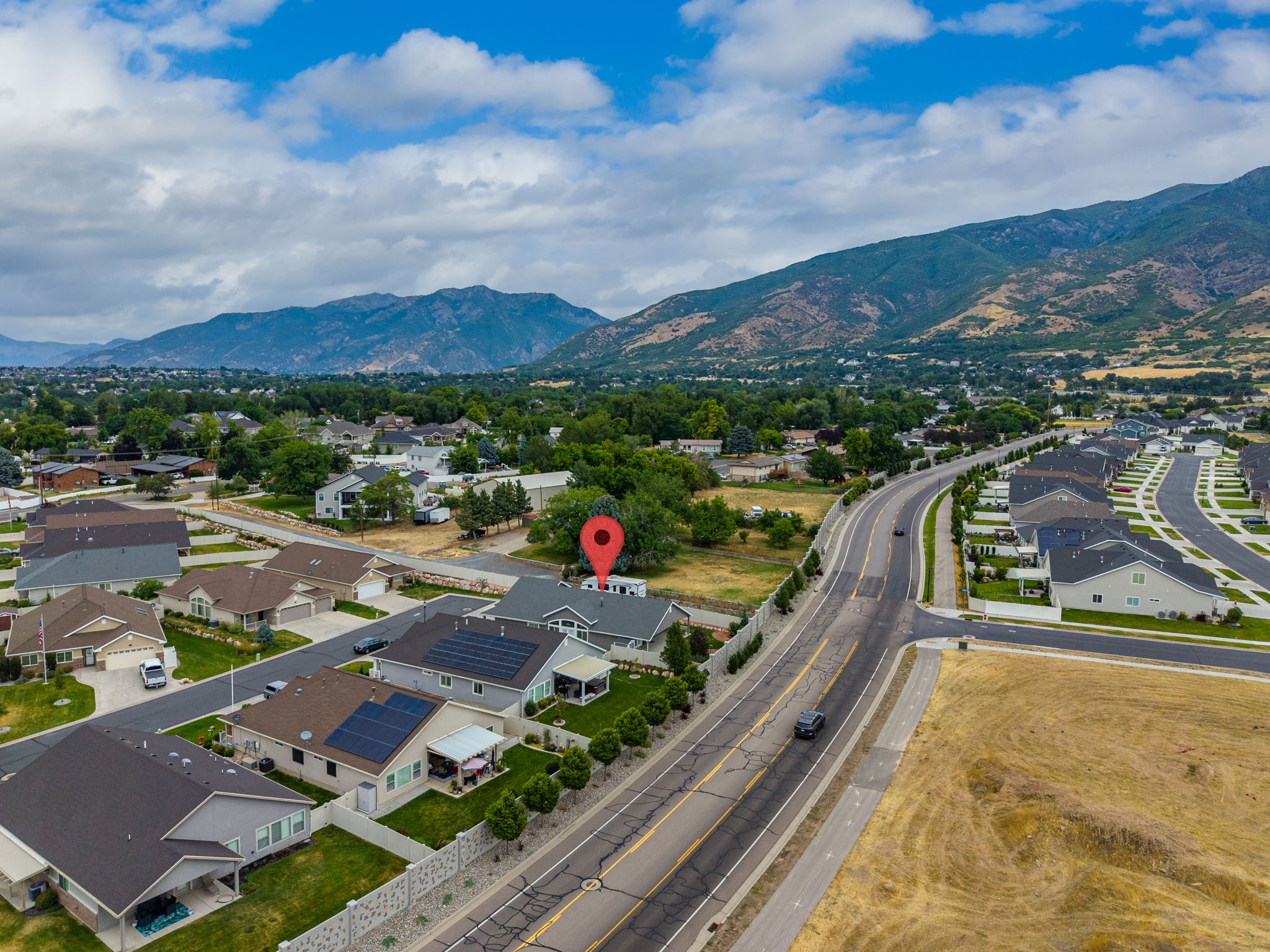 Aerial view of a residential neighborhood with mountain backdrop