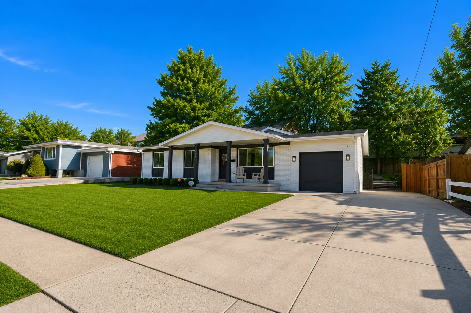 Contemporary residence with a white brick facade and dark trim accents