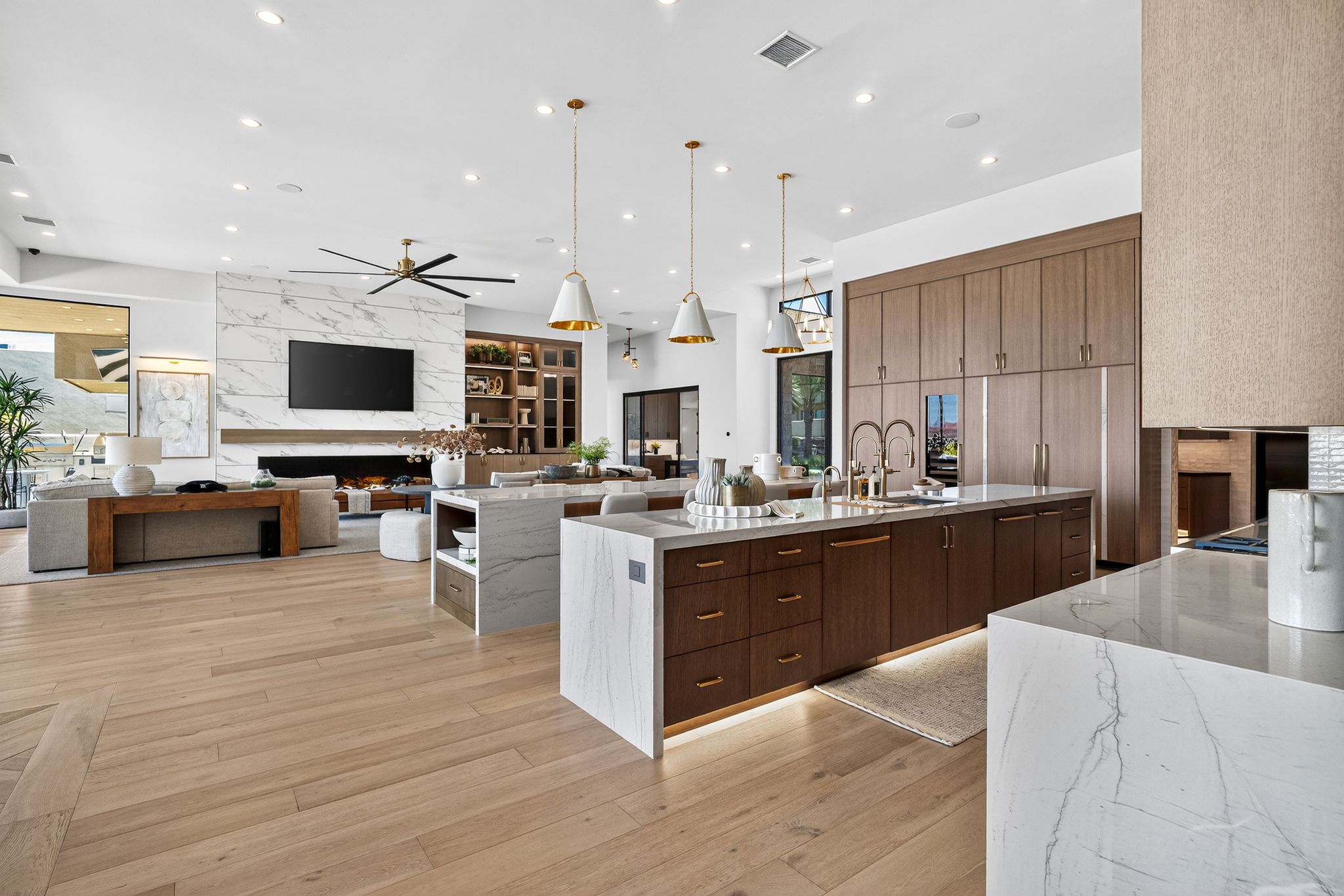 Open-concept living space featuring wide plank wood-finish flooring