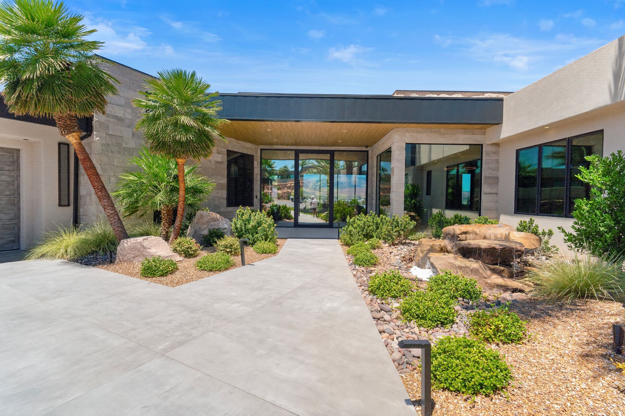 Modern architecture featuring a stone facade and stucco exterior