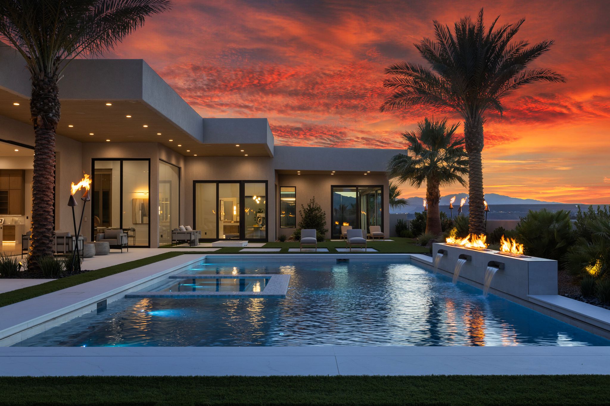 Modern exterior with a multi-level pool featuring an integrated spa