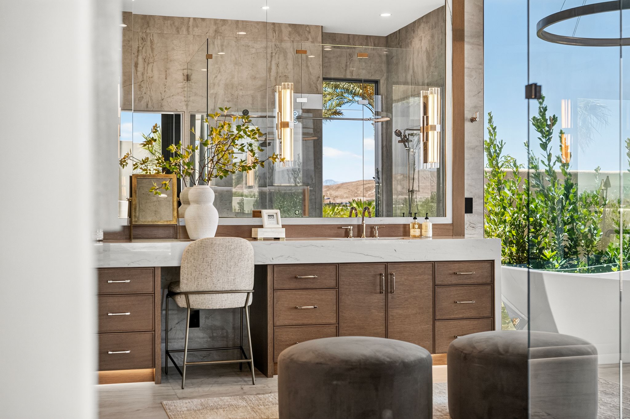 Contemporary bathroom featuring a floating vanity with a white countertop and wood-finish cabinetry