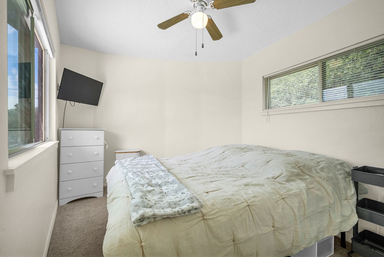 Bedroom featuring neutral carpeting and light-toned walls