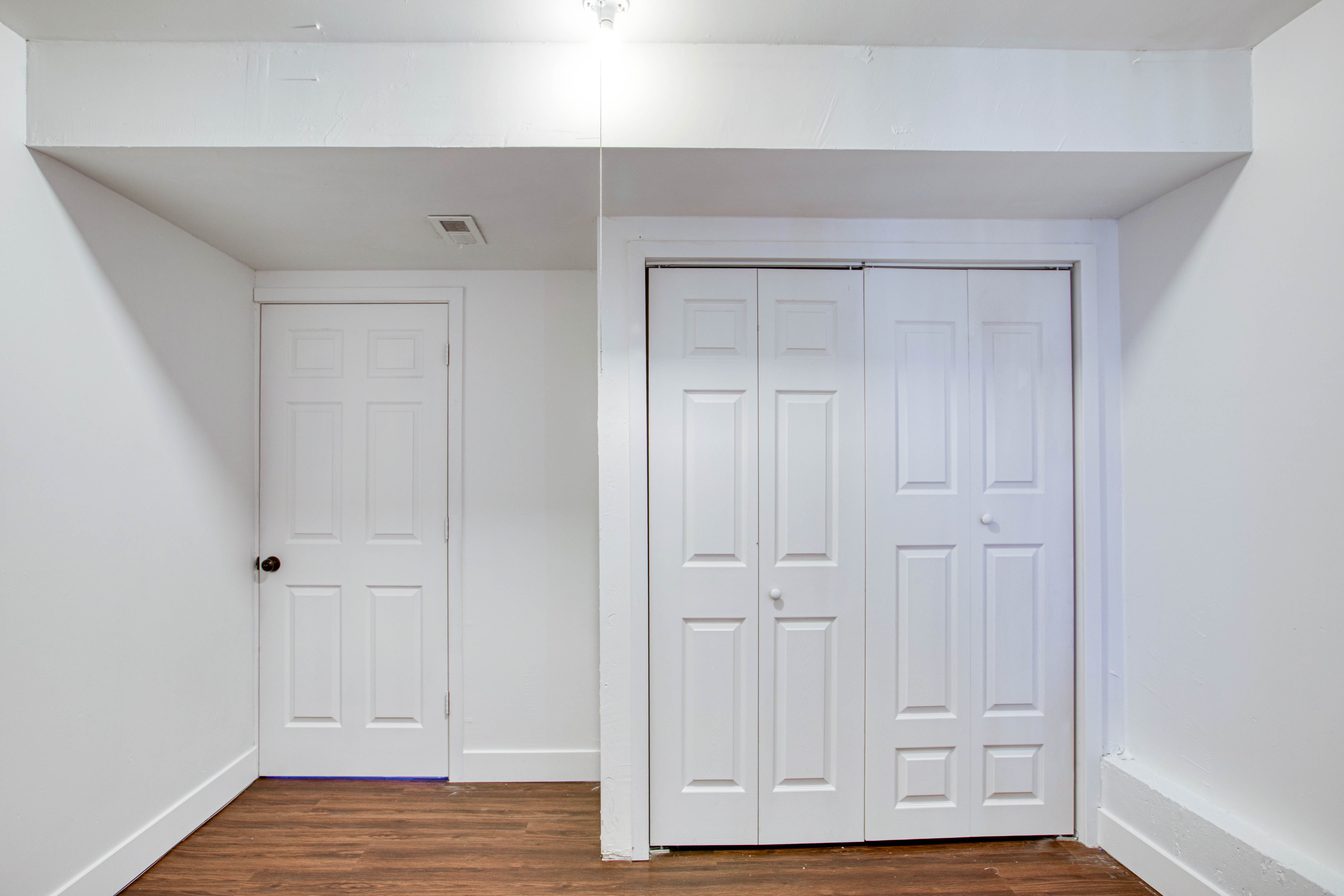 Wood-finish flooring paired with white walls