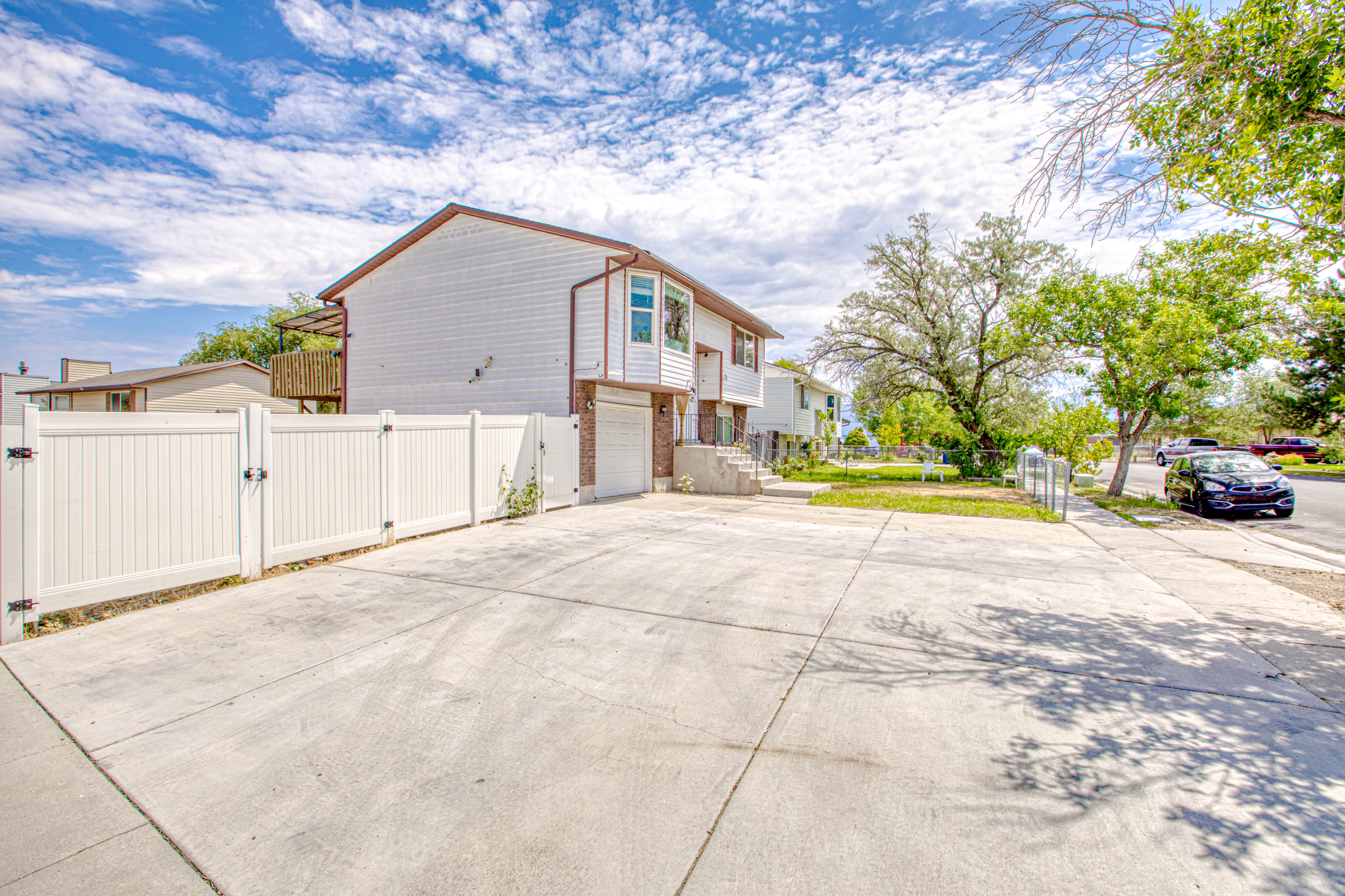 Property exterior featuring white siding and brown trim