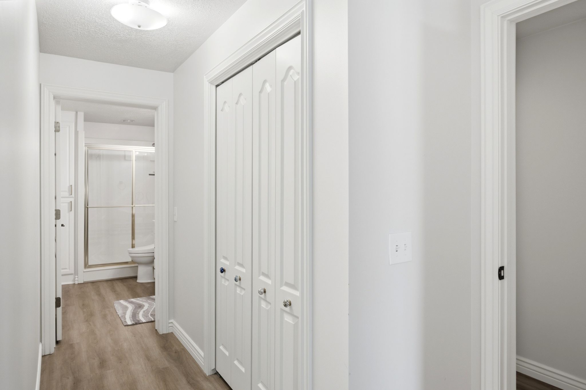 Primary bedroom en suite access with extra closet space.