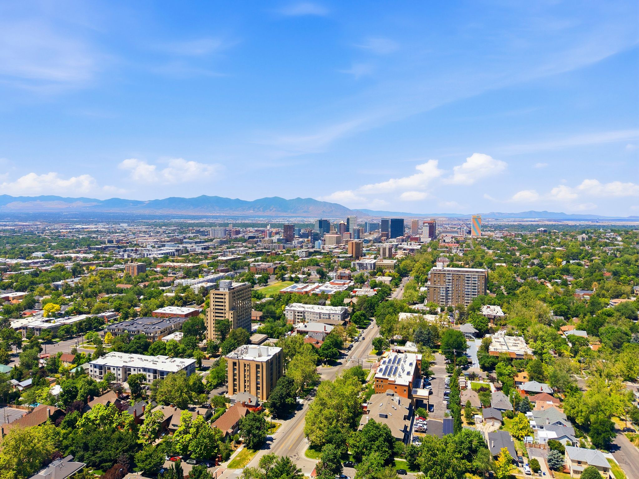 Expansive aerial perspective showcasing a metropolitan area with a prominent skyline