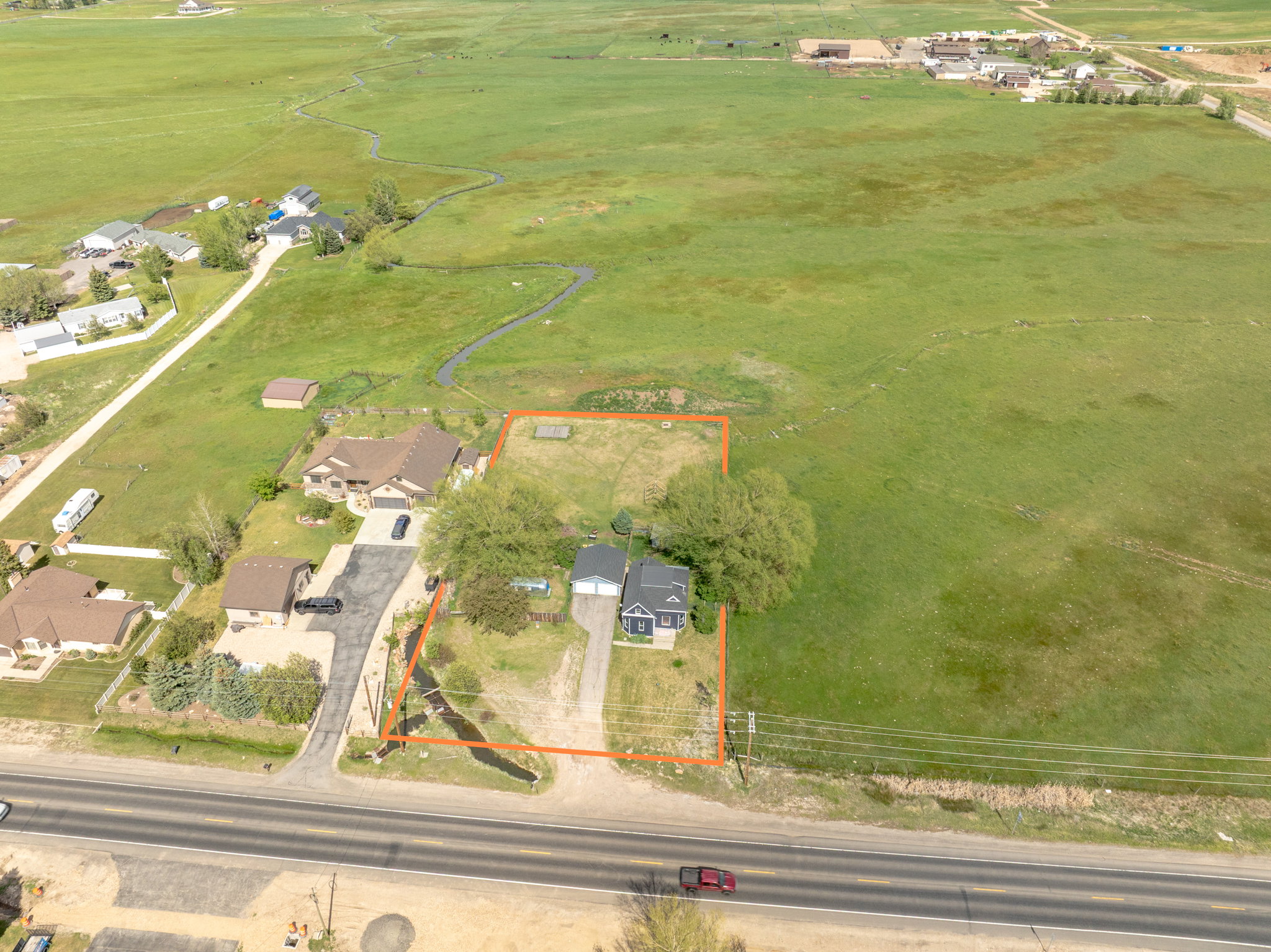 Aerial perspective showcasing a property with a distinct perimeter