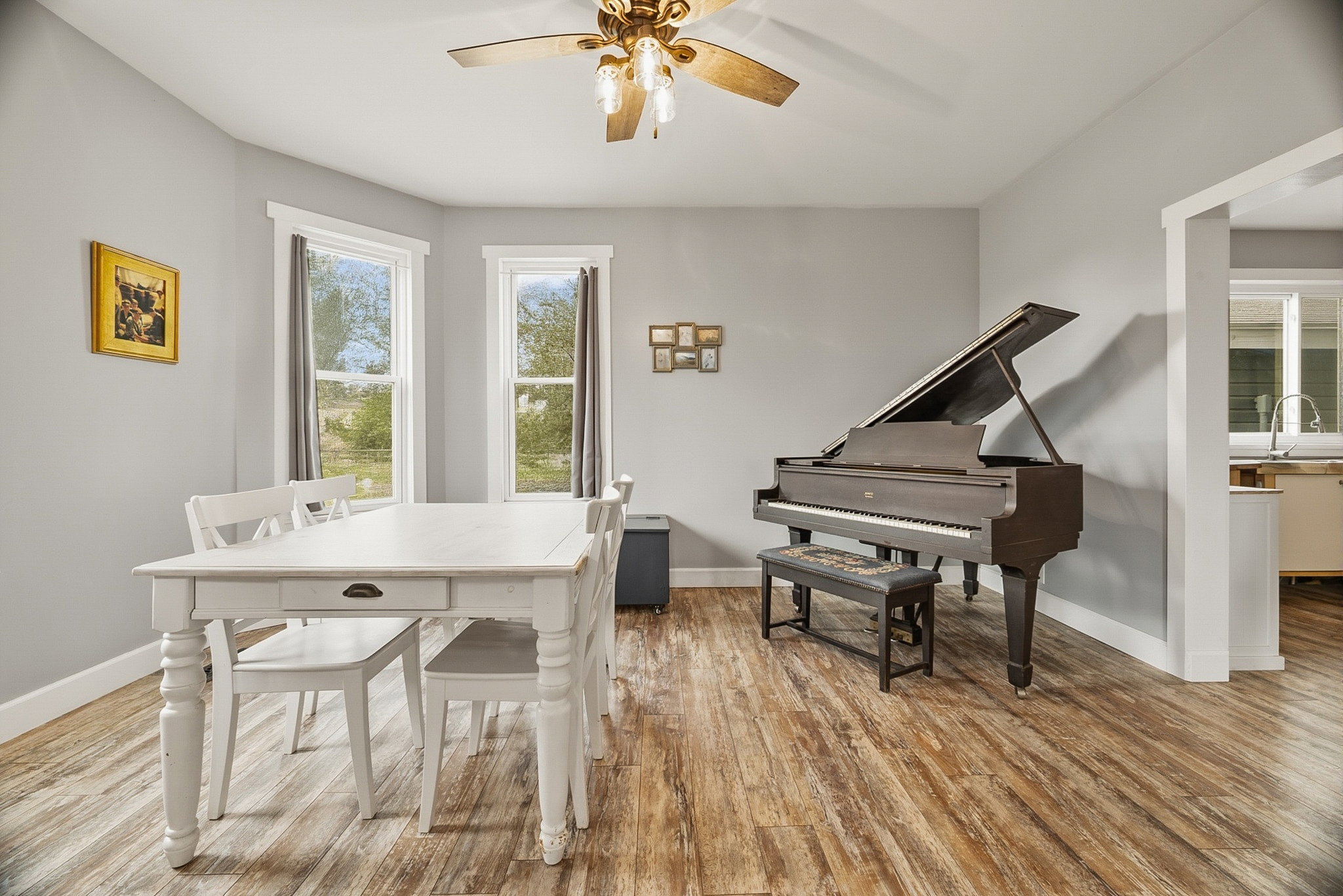 Spacious room featuring wood-finish flooring and light gray wall paint