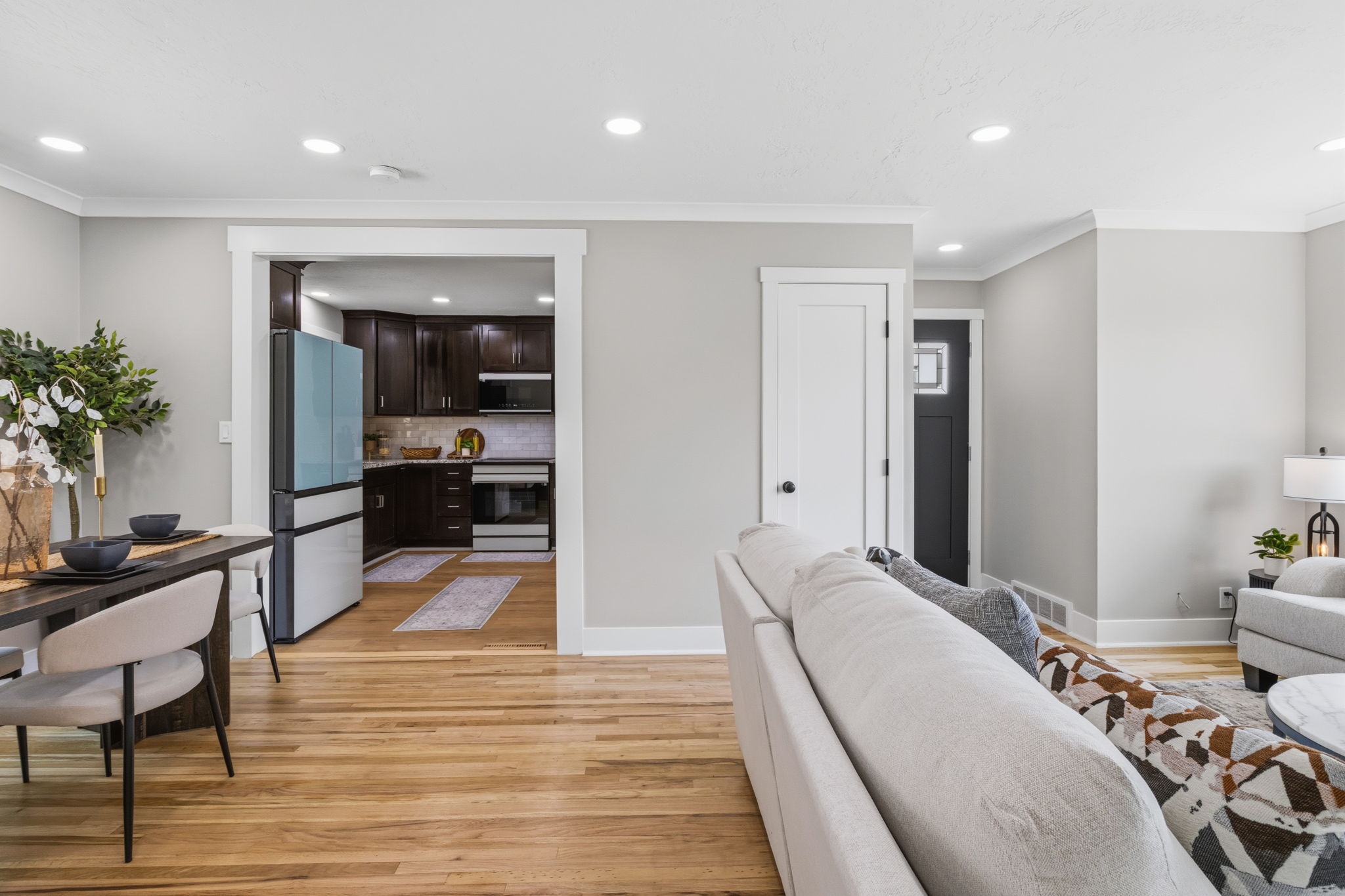 Hardwood flooring extends throughout this open-concept living space