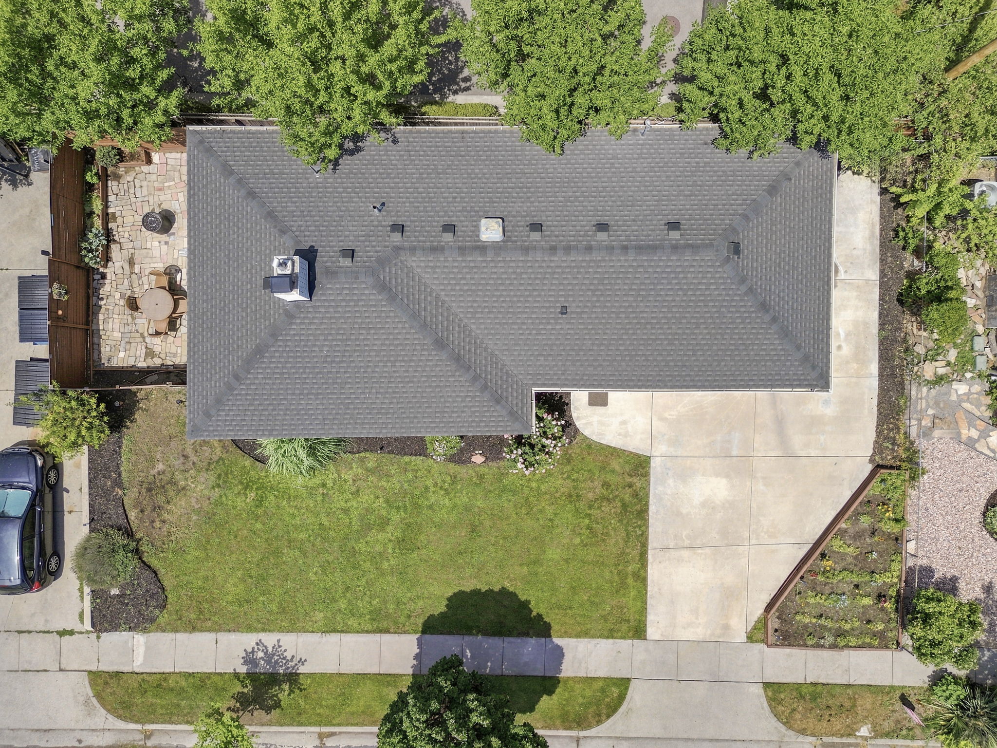 Gable roof with asphalt shingles and a central chimney