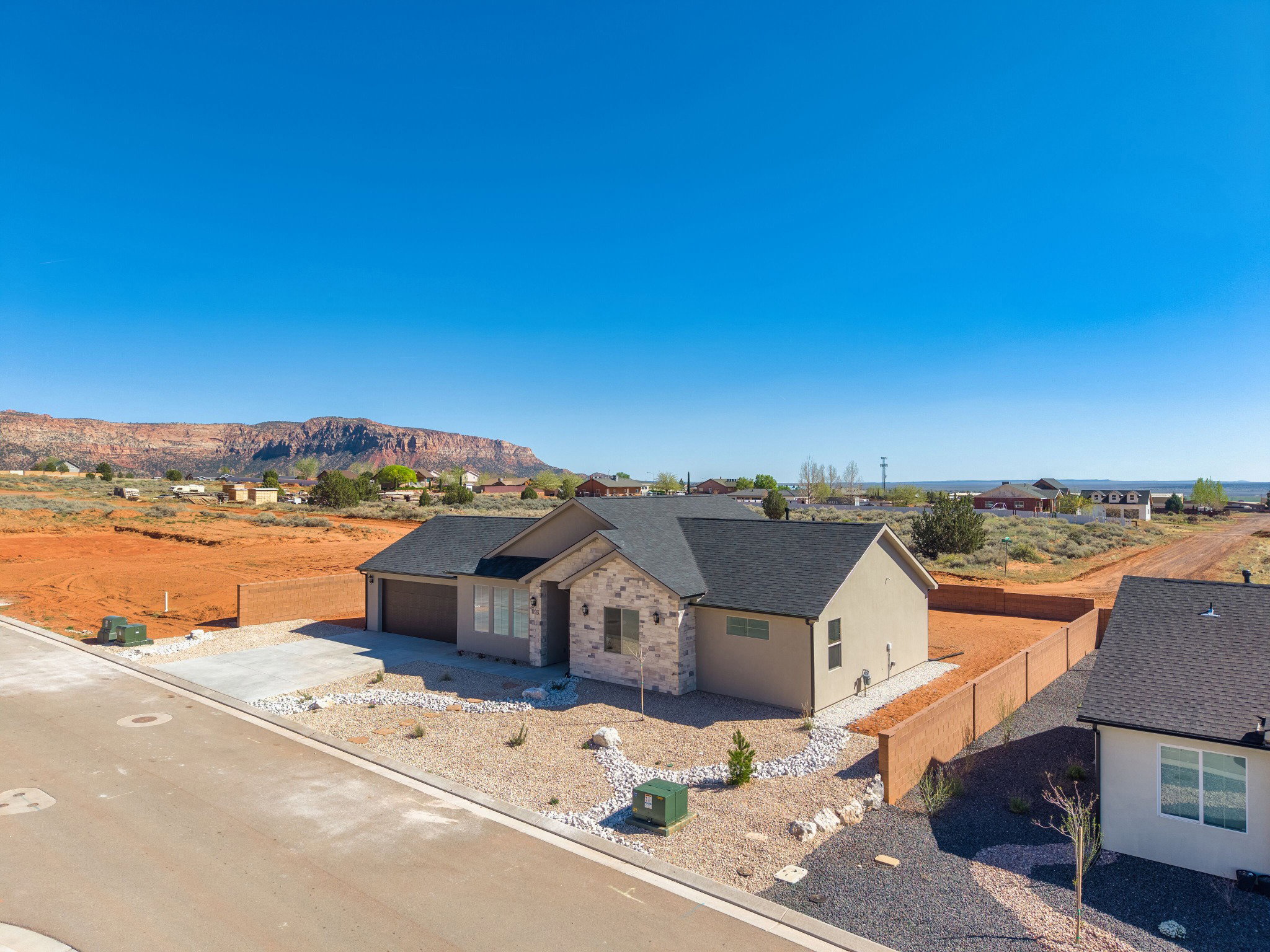 Newly constructed single-story residence featuring a two-car garage