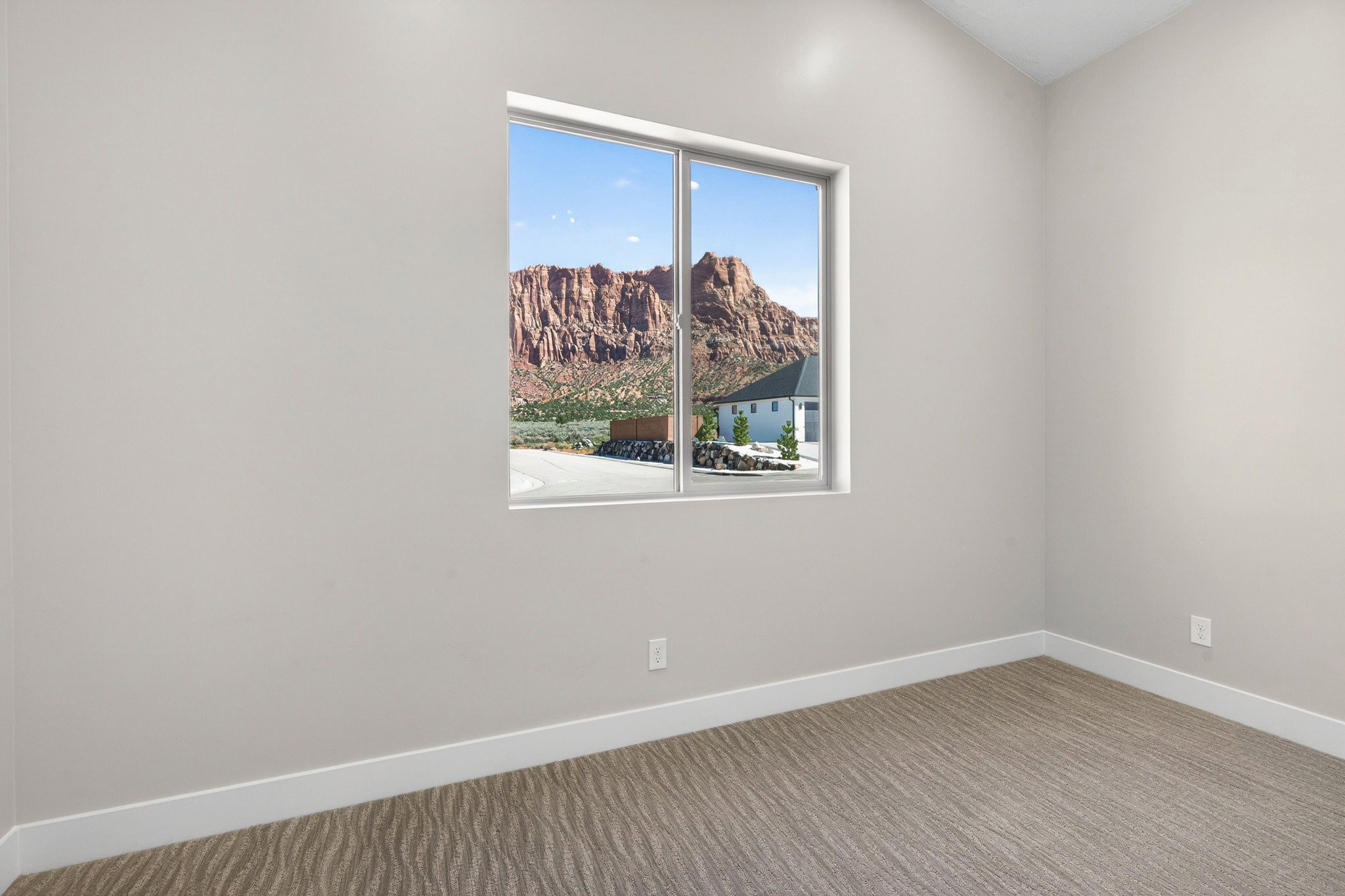 Recessed window framing expansive mountain scenery