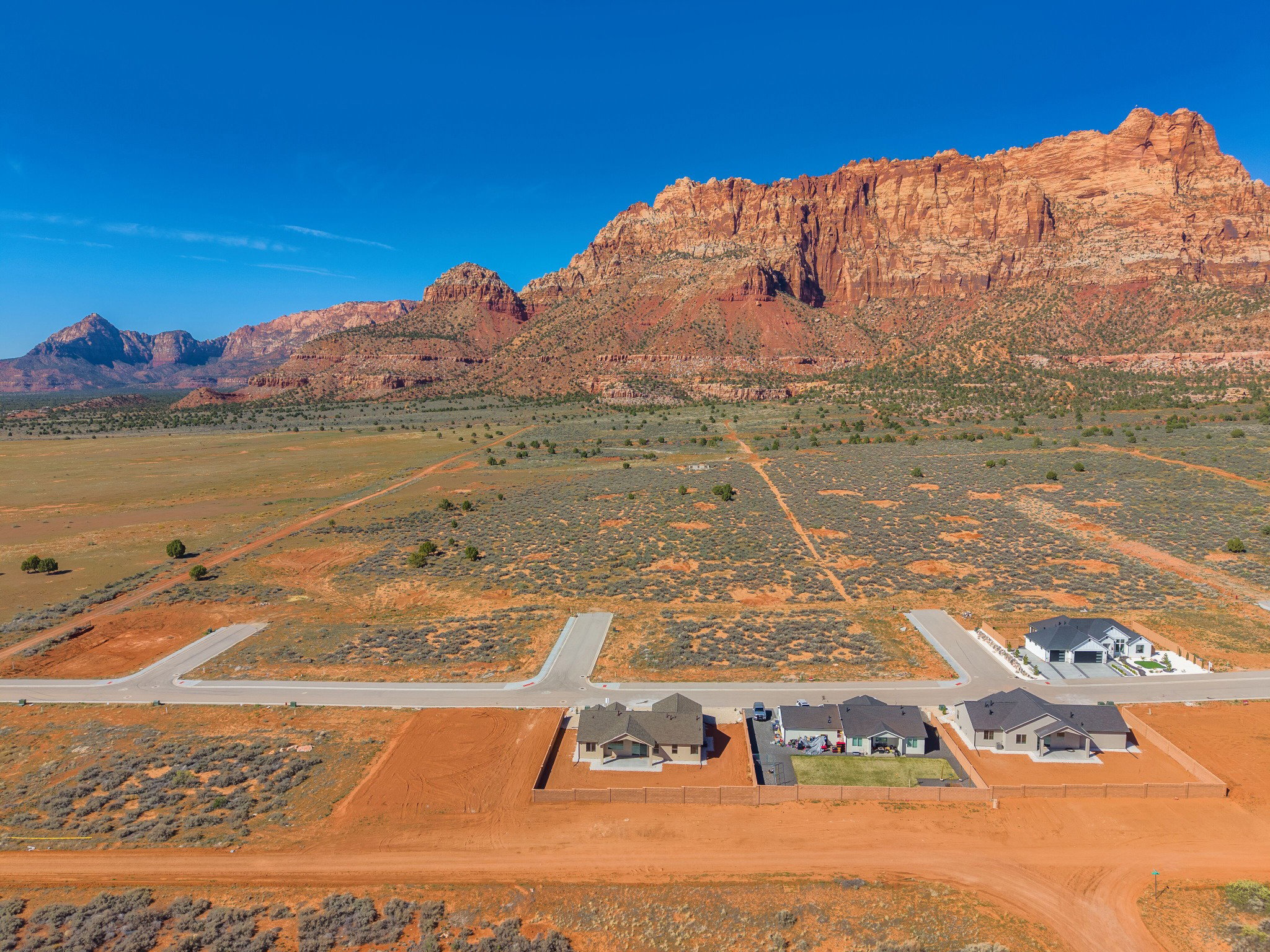 Expansive desert landscape featuring a prominent mountain backdrop