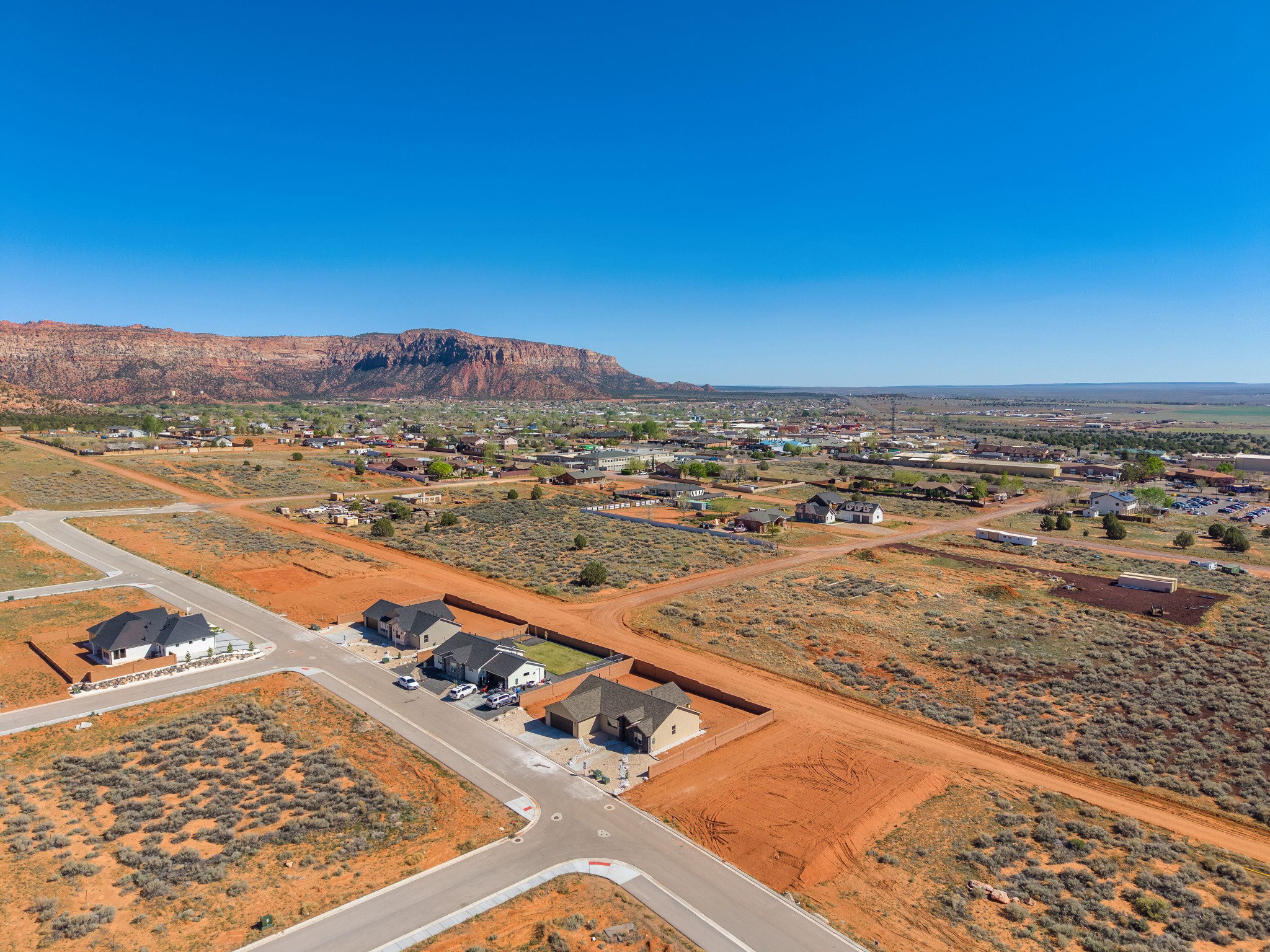 Expansive land parcel featuring new construction homes, established residential areas, and undeveloped lots
