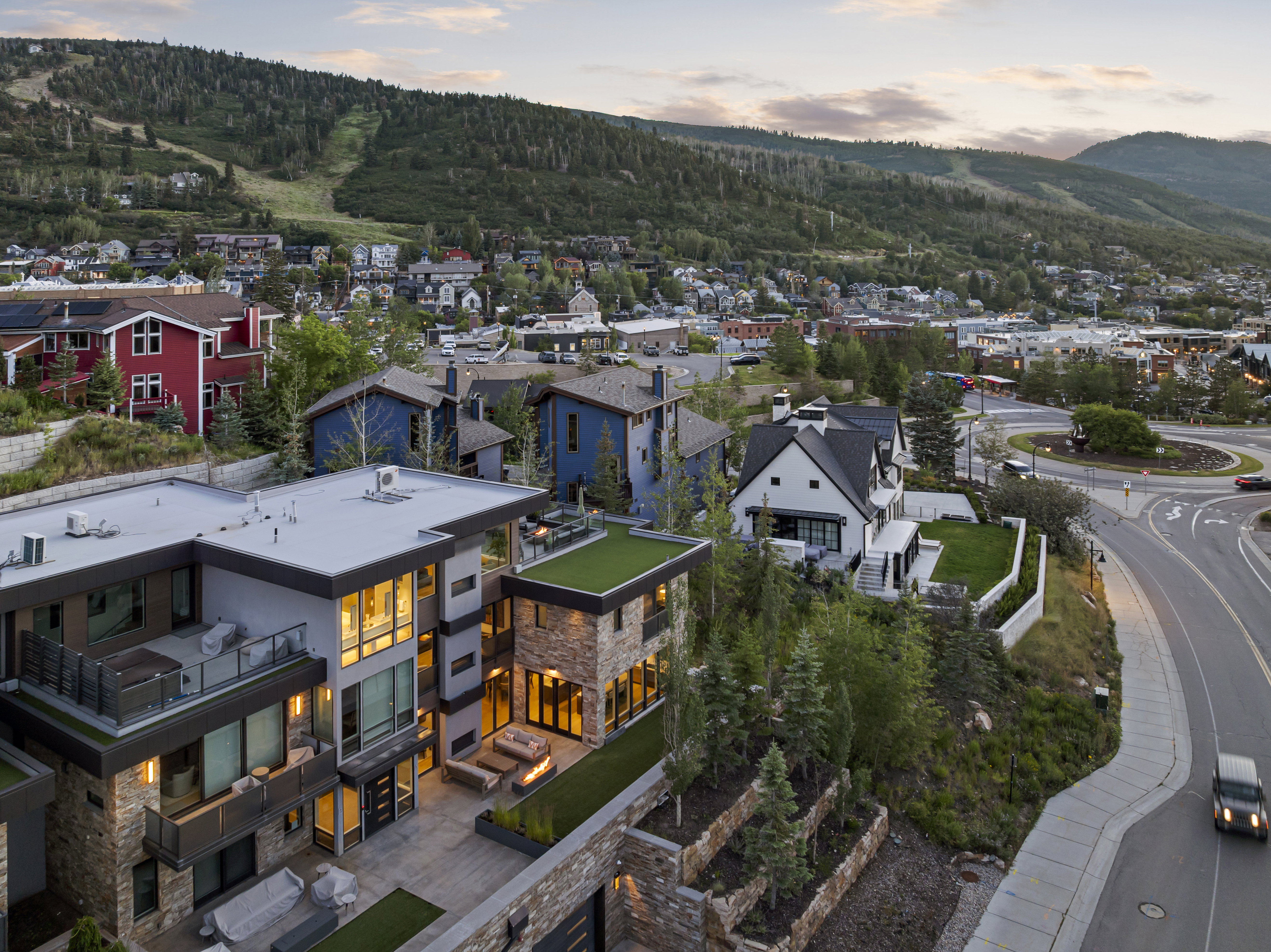 Modern multi-level residence featuring stone accents and expansive windows