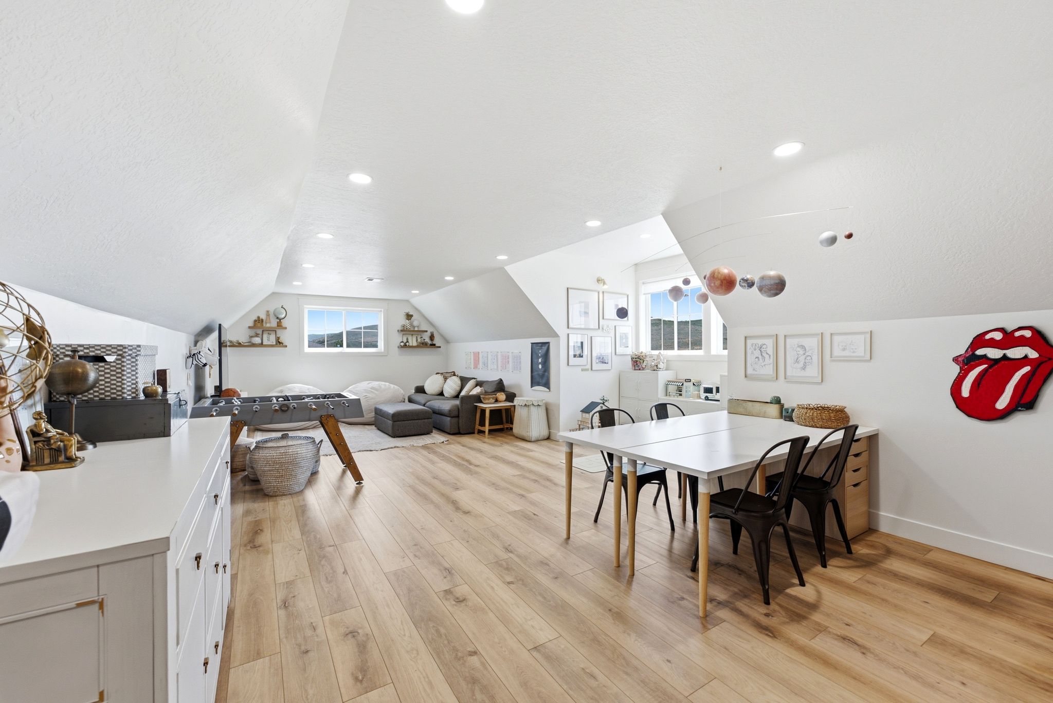Spacious attic conversion featuring wood-finish flooring throughout