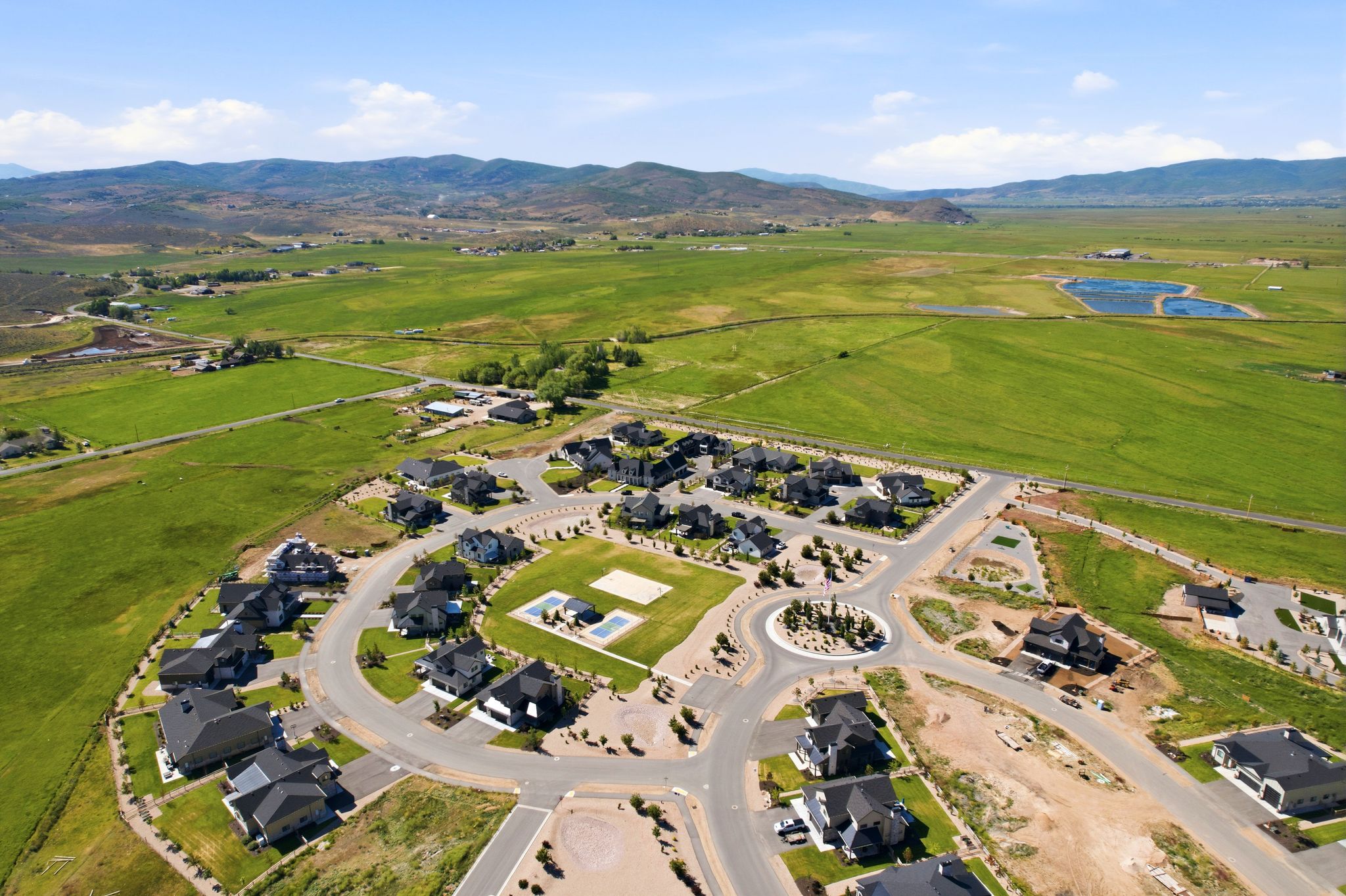 Aerial perspective showcasing a developed residential community and surrounding natural landscape